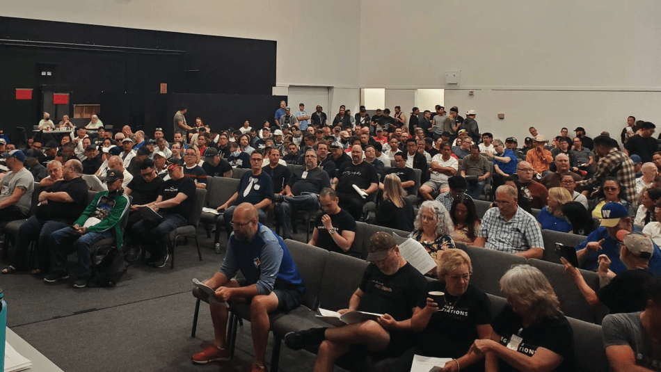 Unifor Local 2169 members gathered indoors at a ratification meeting.