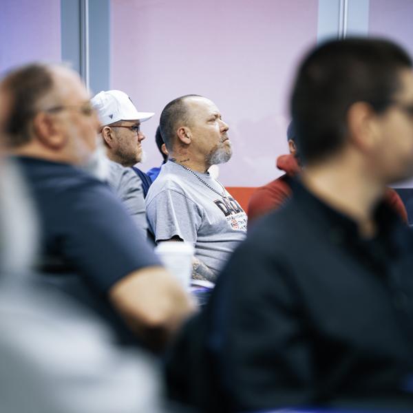 Unifor members People seated listening to a someone out of frame.