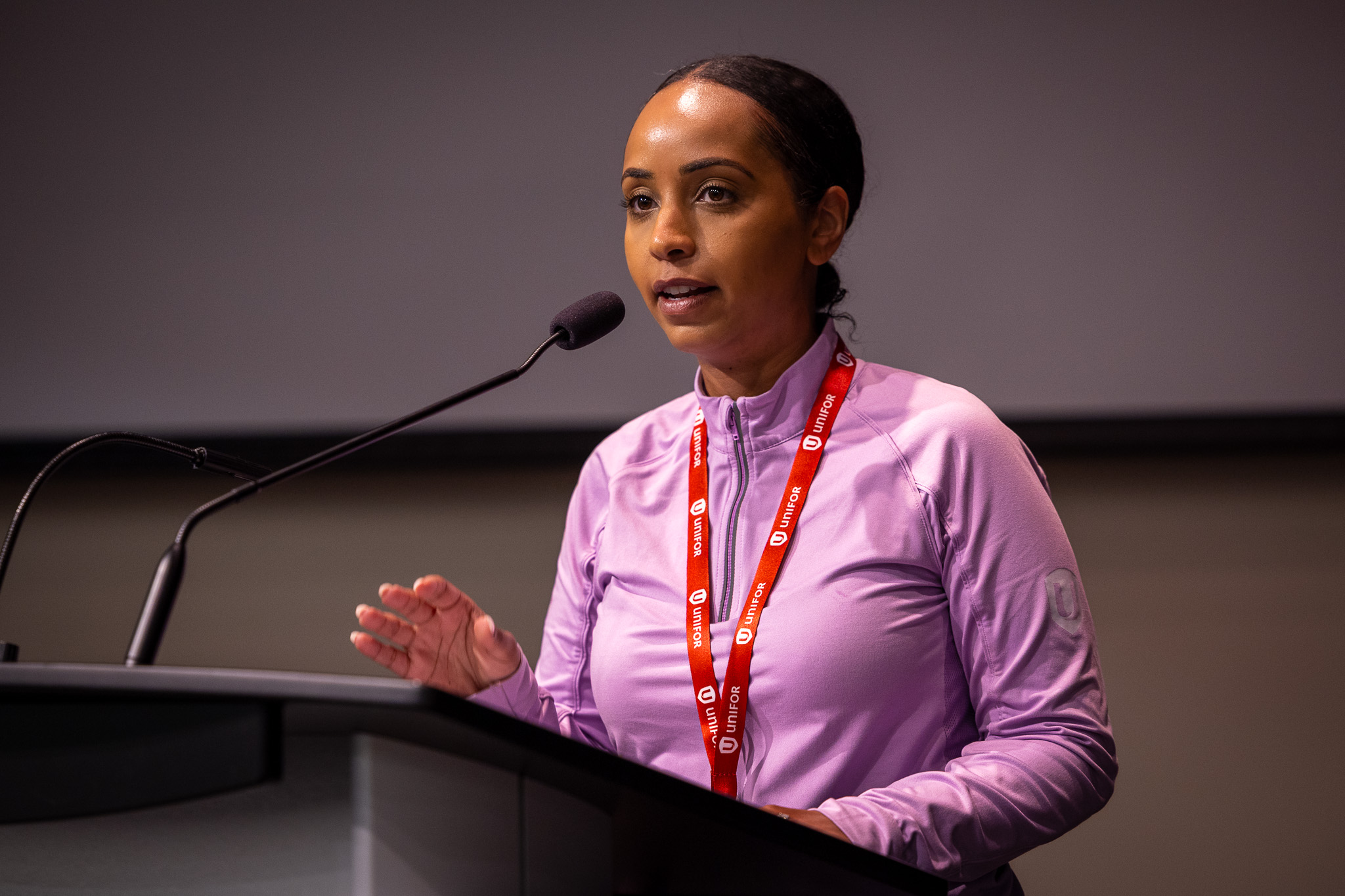 A women speaks at a podium