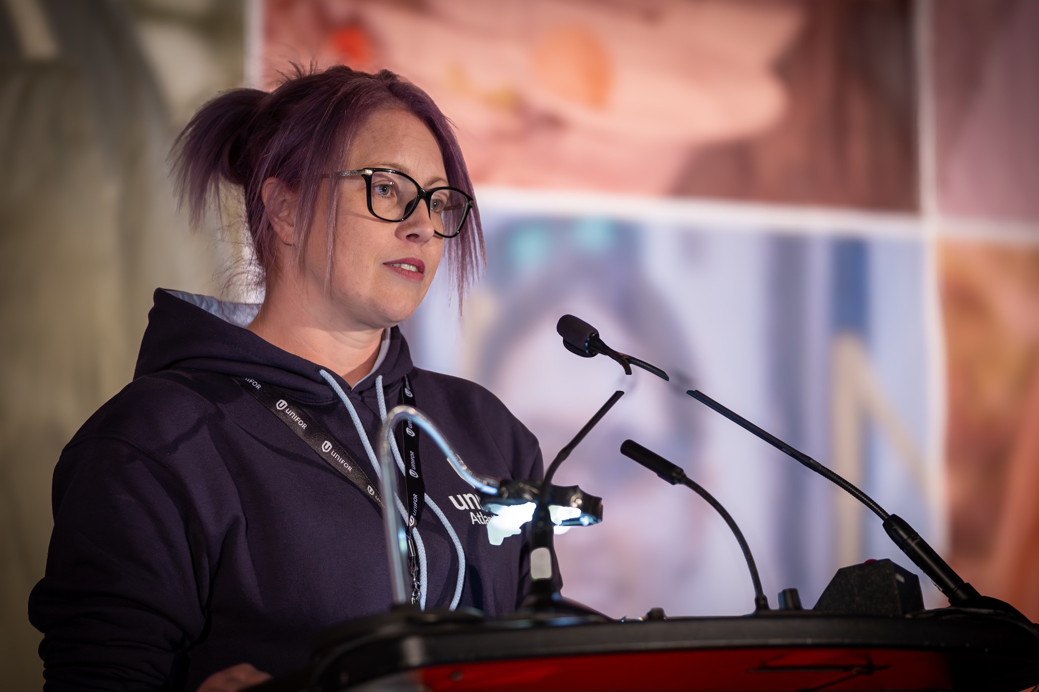 A women speaking at a podium