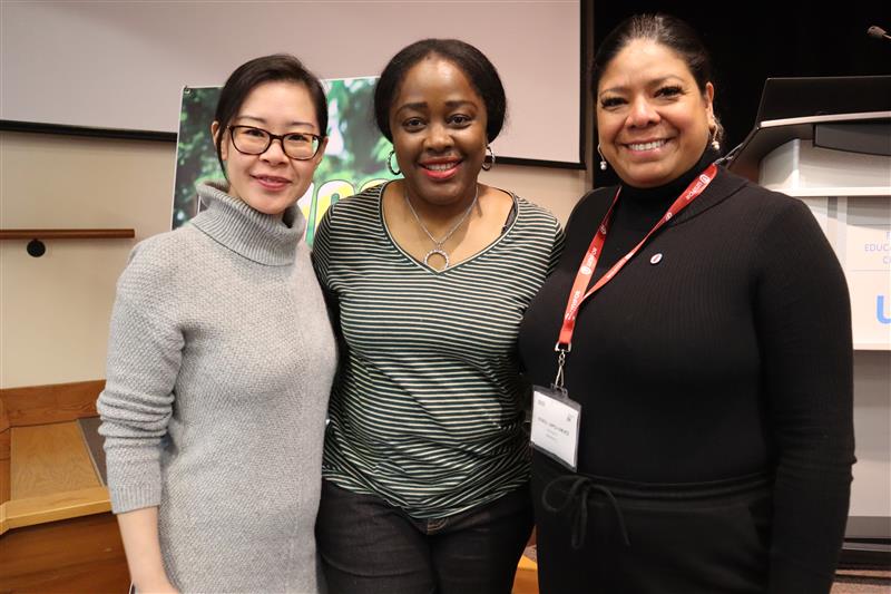 Three women posing smiling