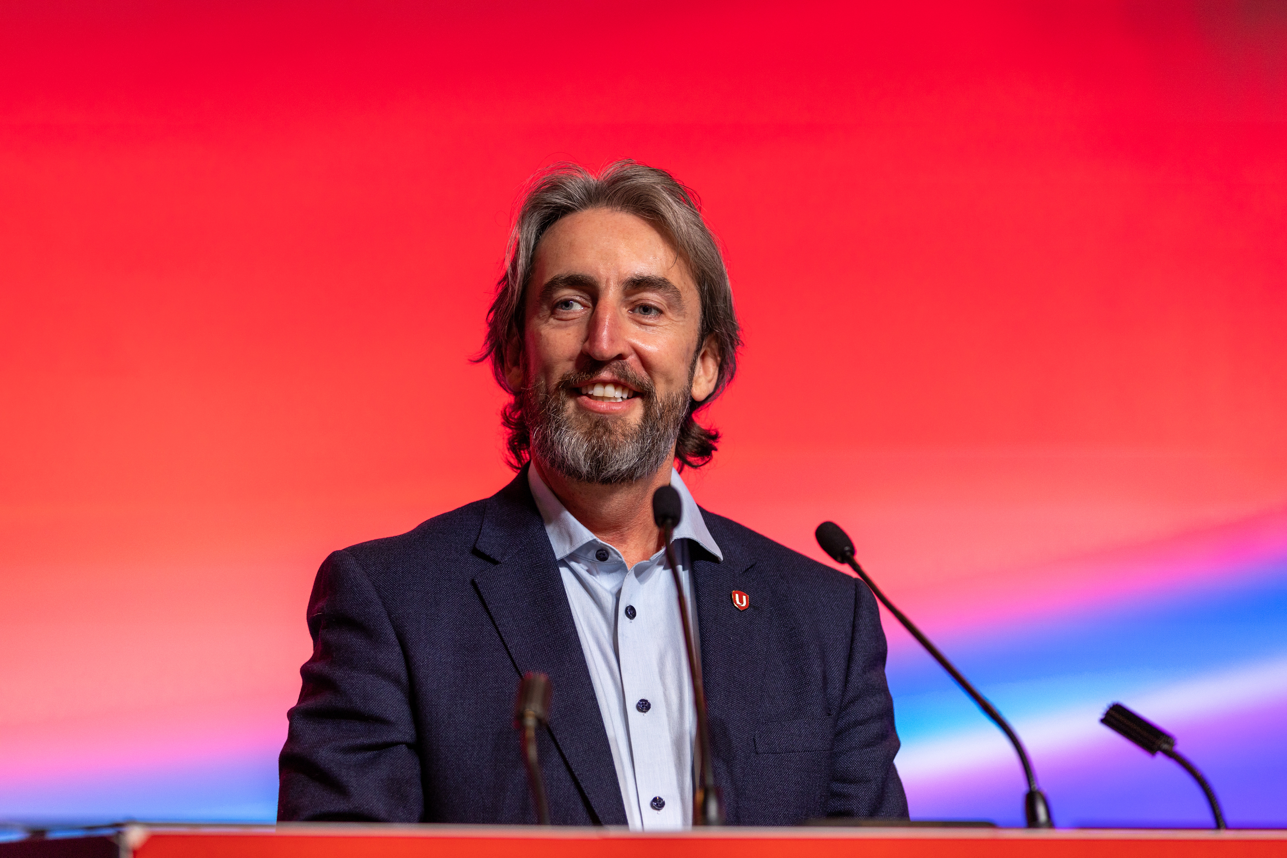 Gavin McGarrigle speaking at the podium at Canadian Council