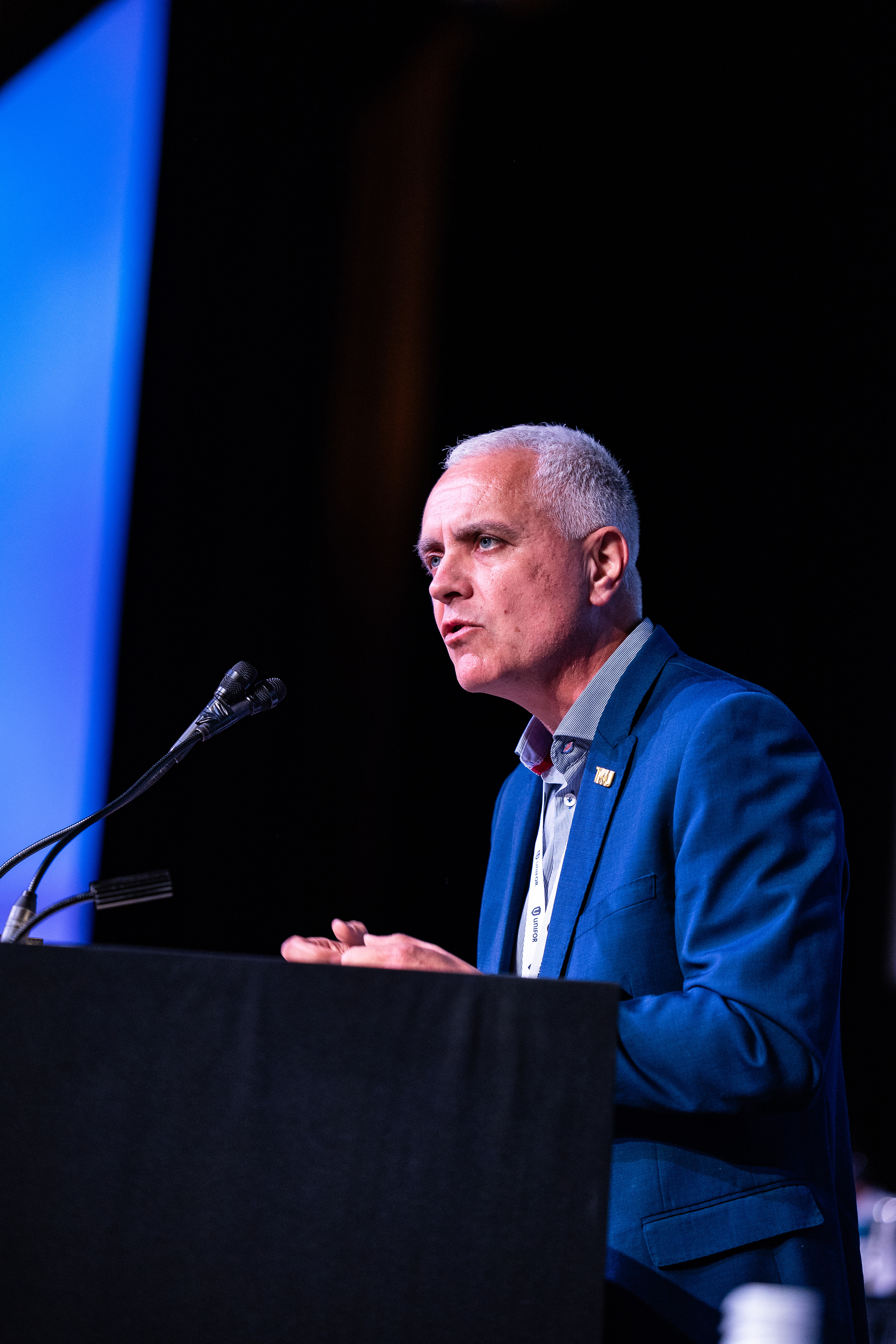 A man speaking at a podium