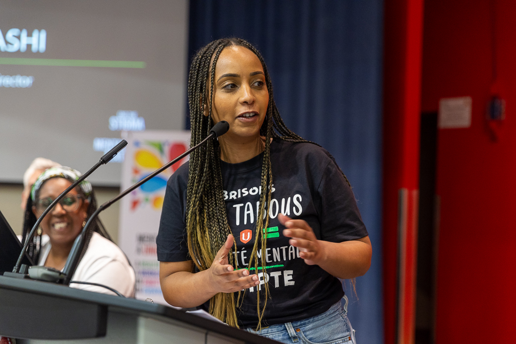 A women speaking at a mic