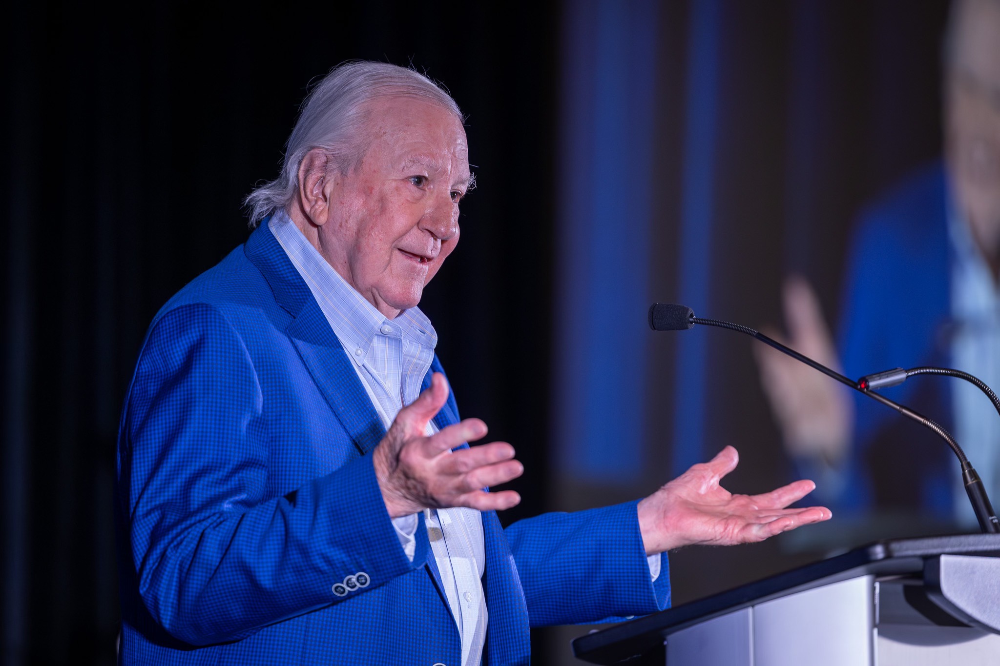 man with hands raised