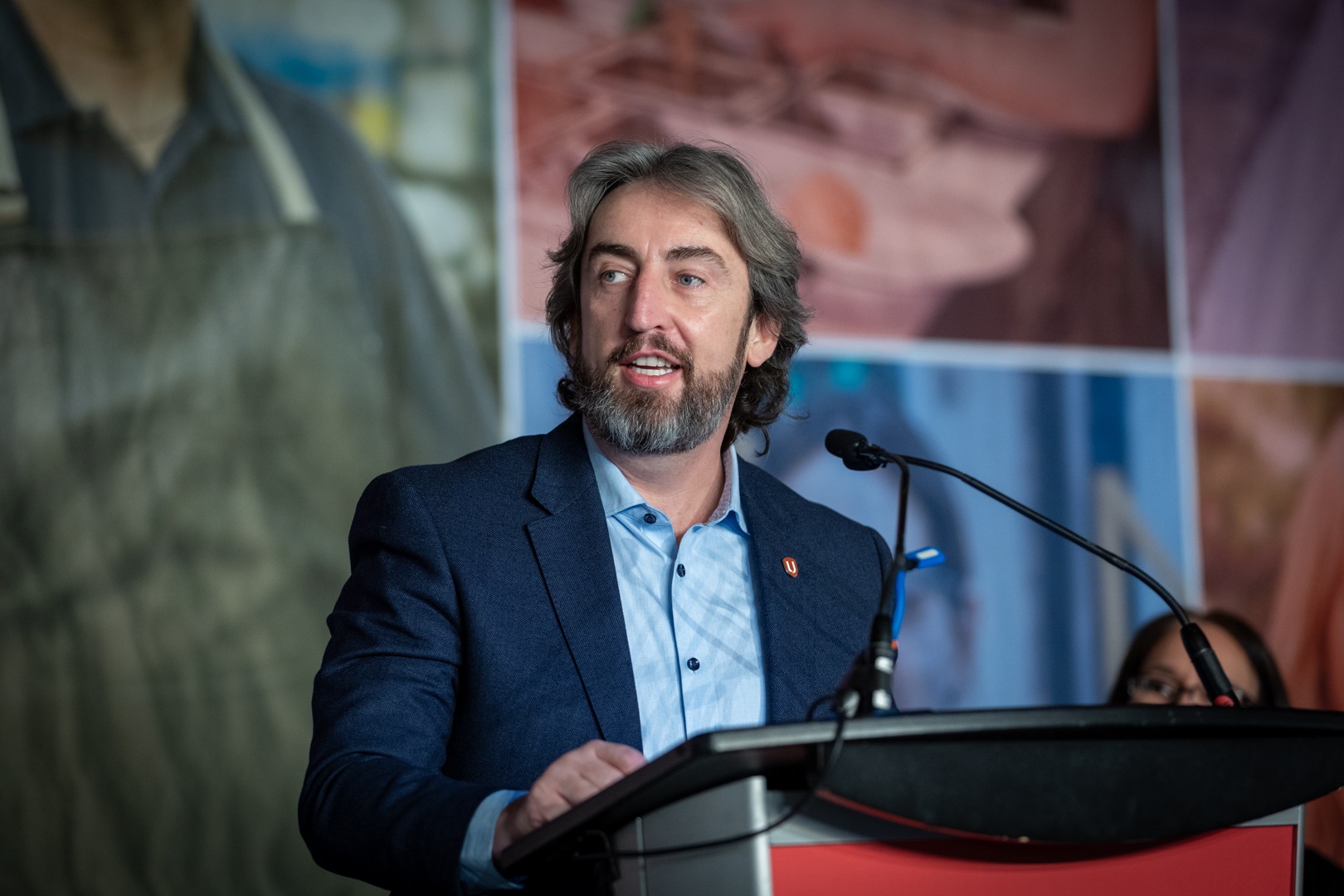 Gavin McGarrigle speaking at the podium