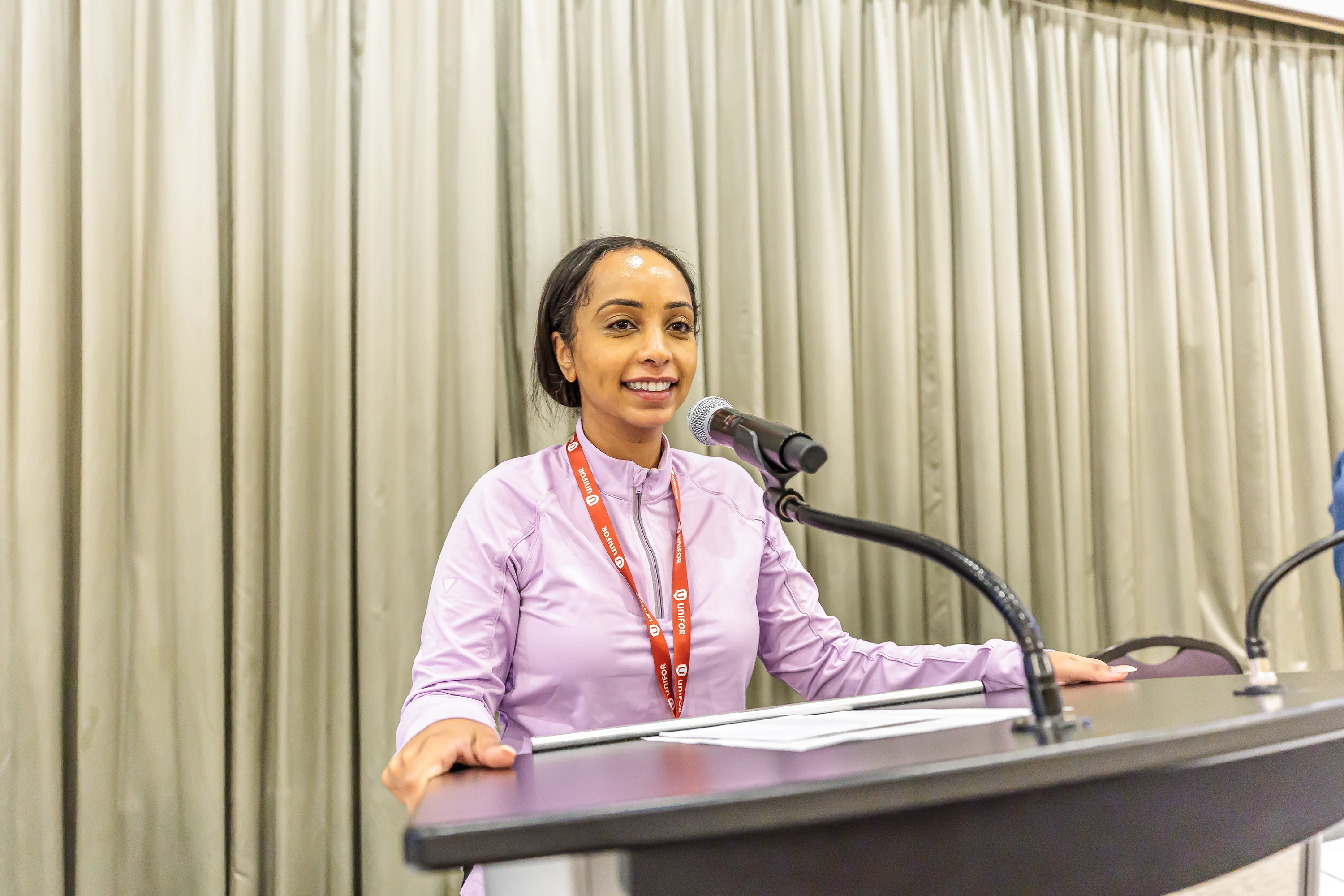 A women speaks at a podium