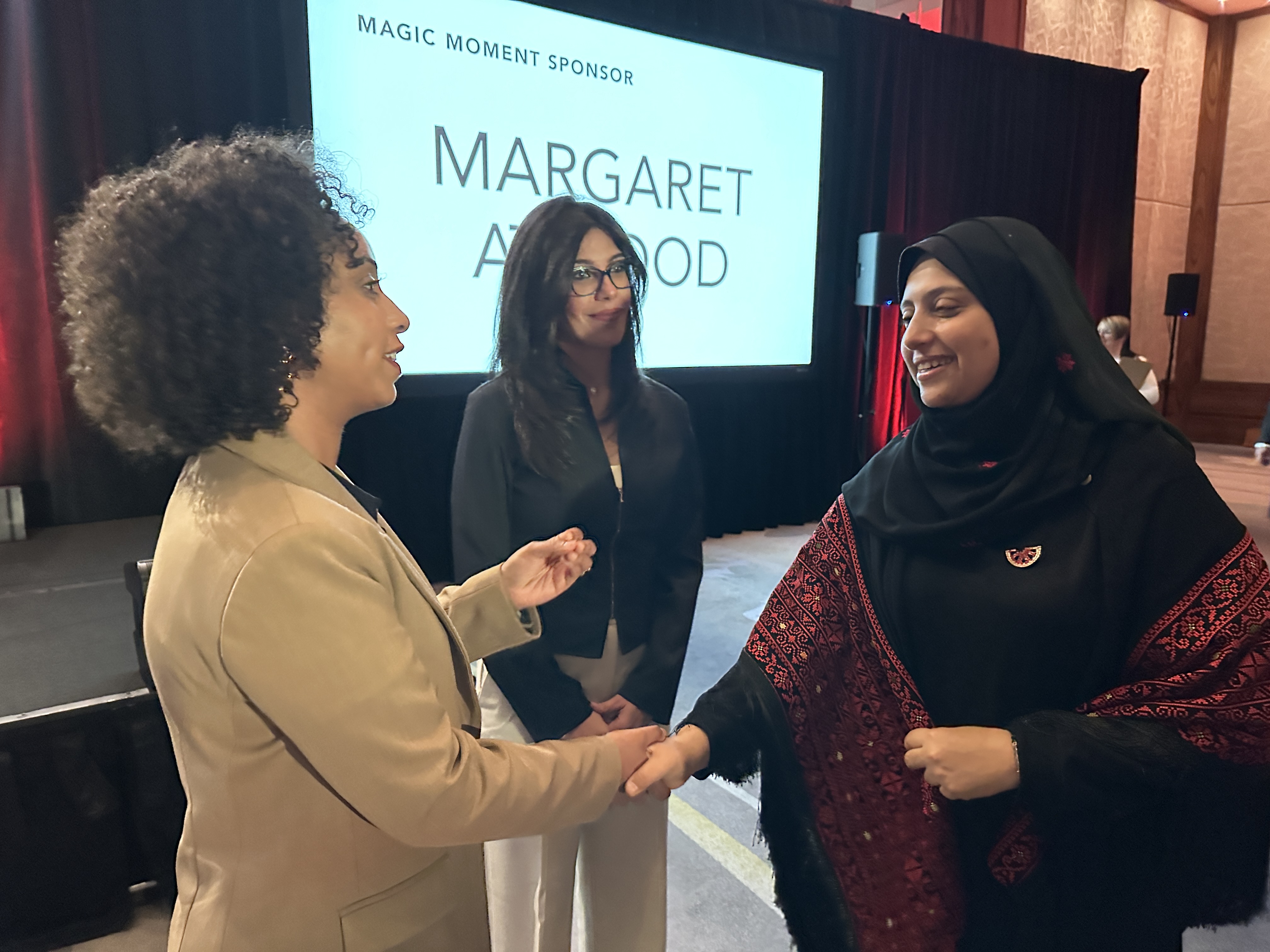 two women shaking hand