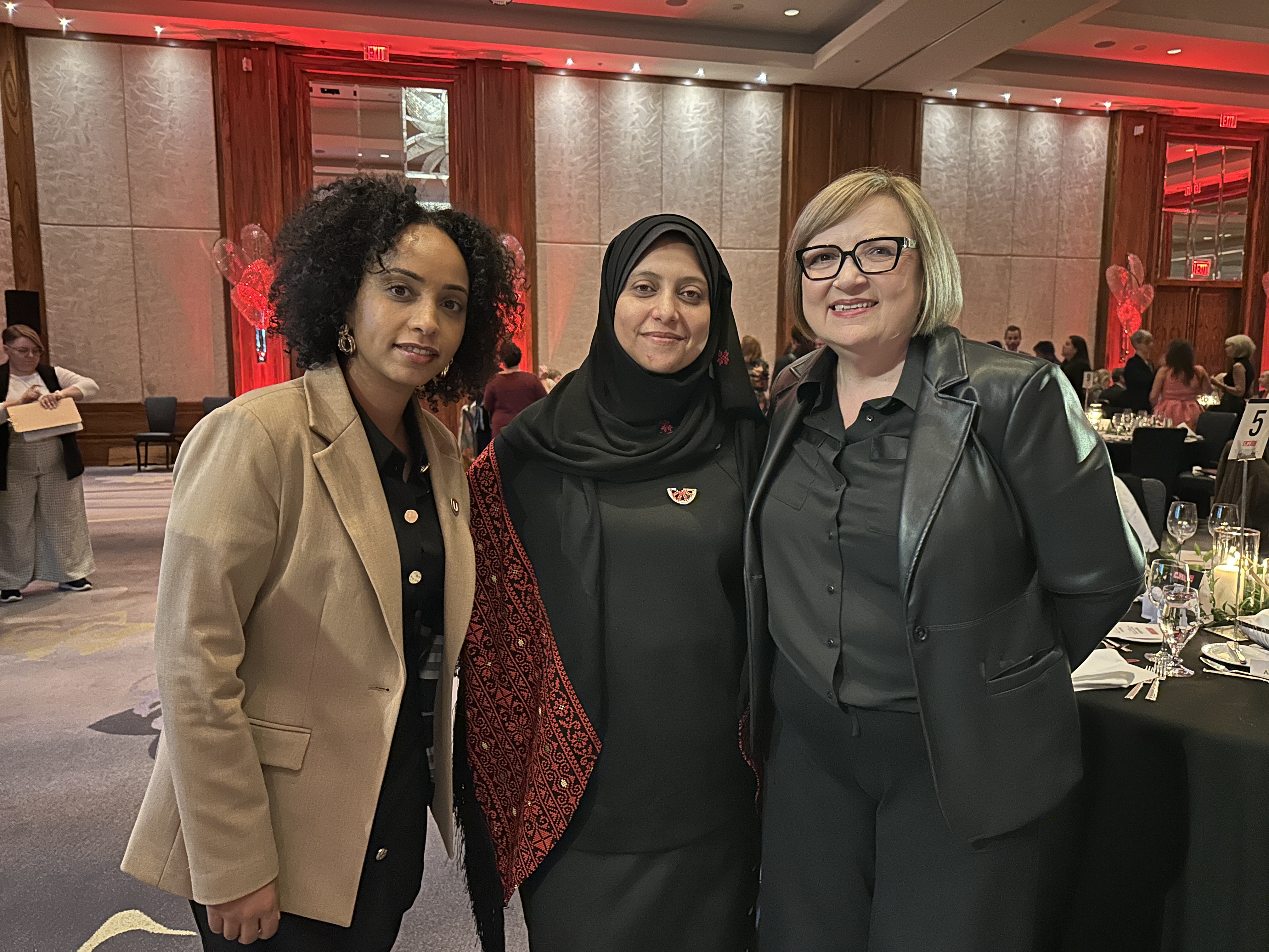 three womens smiling together