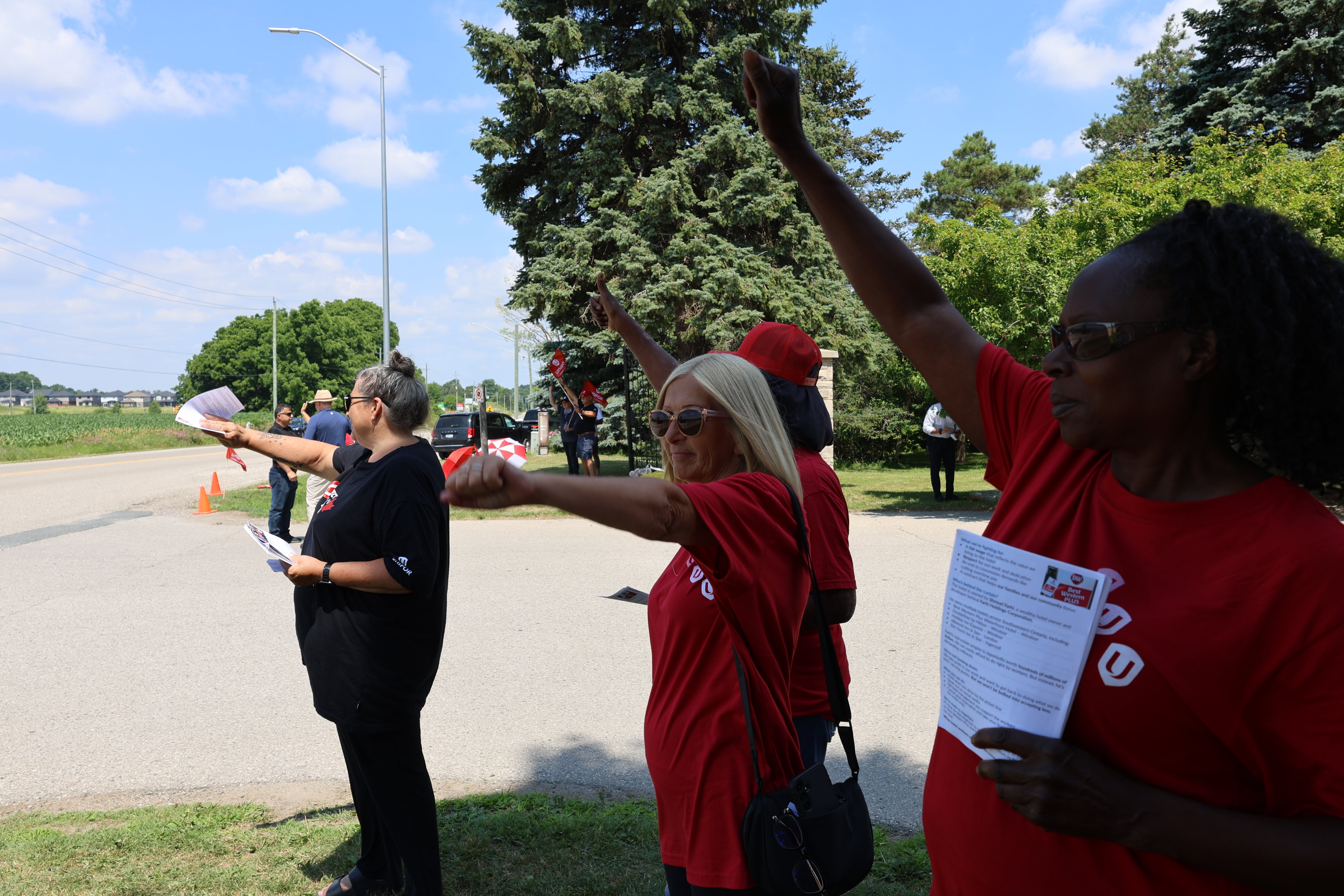 women standing with fists raised in the air