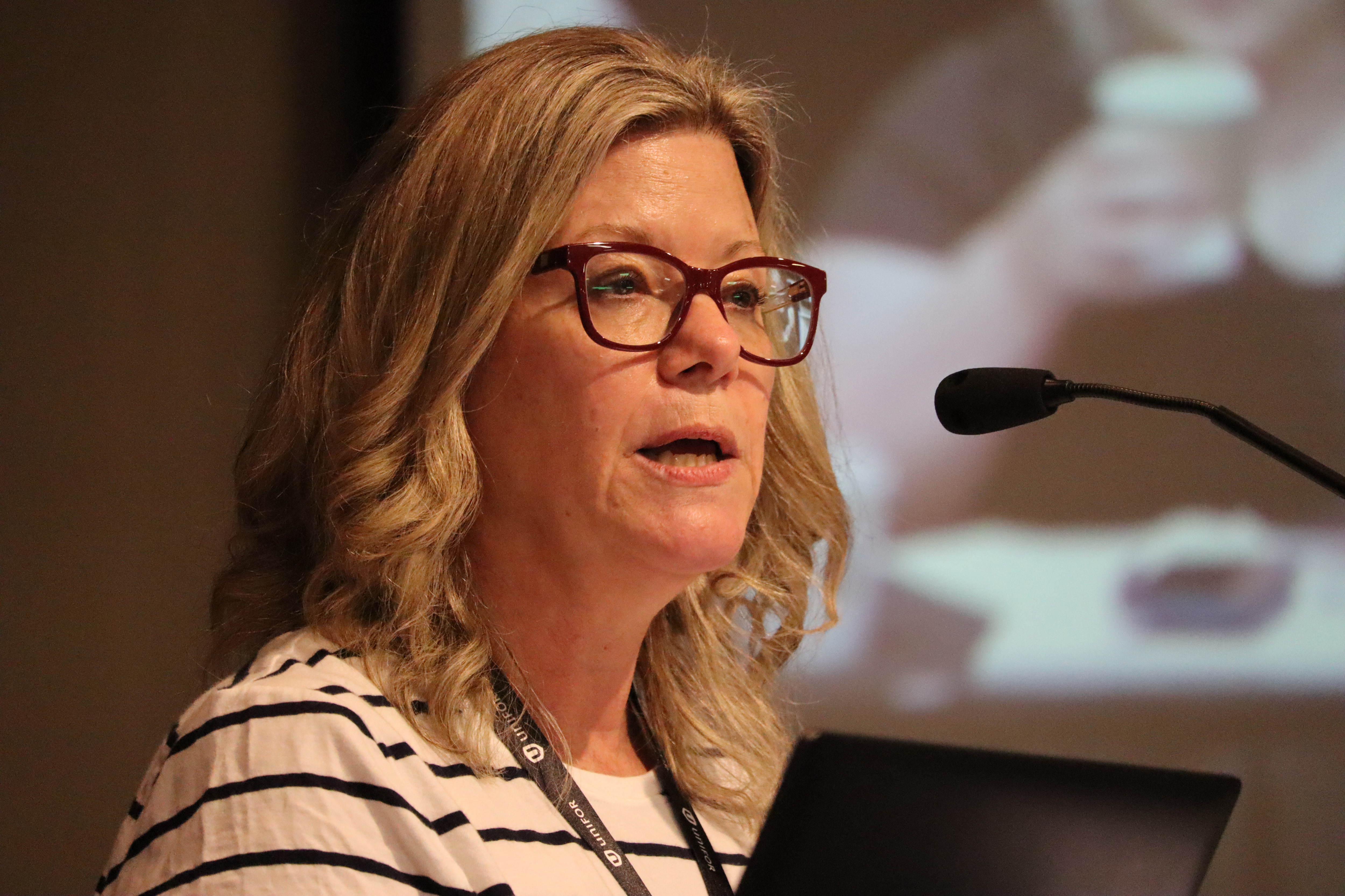 A woman speaking at a podium