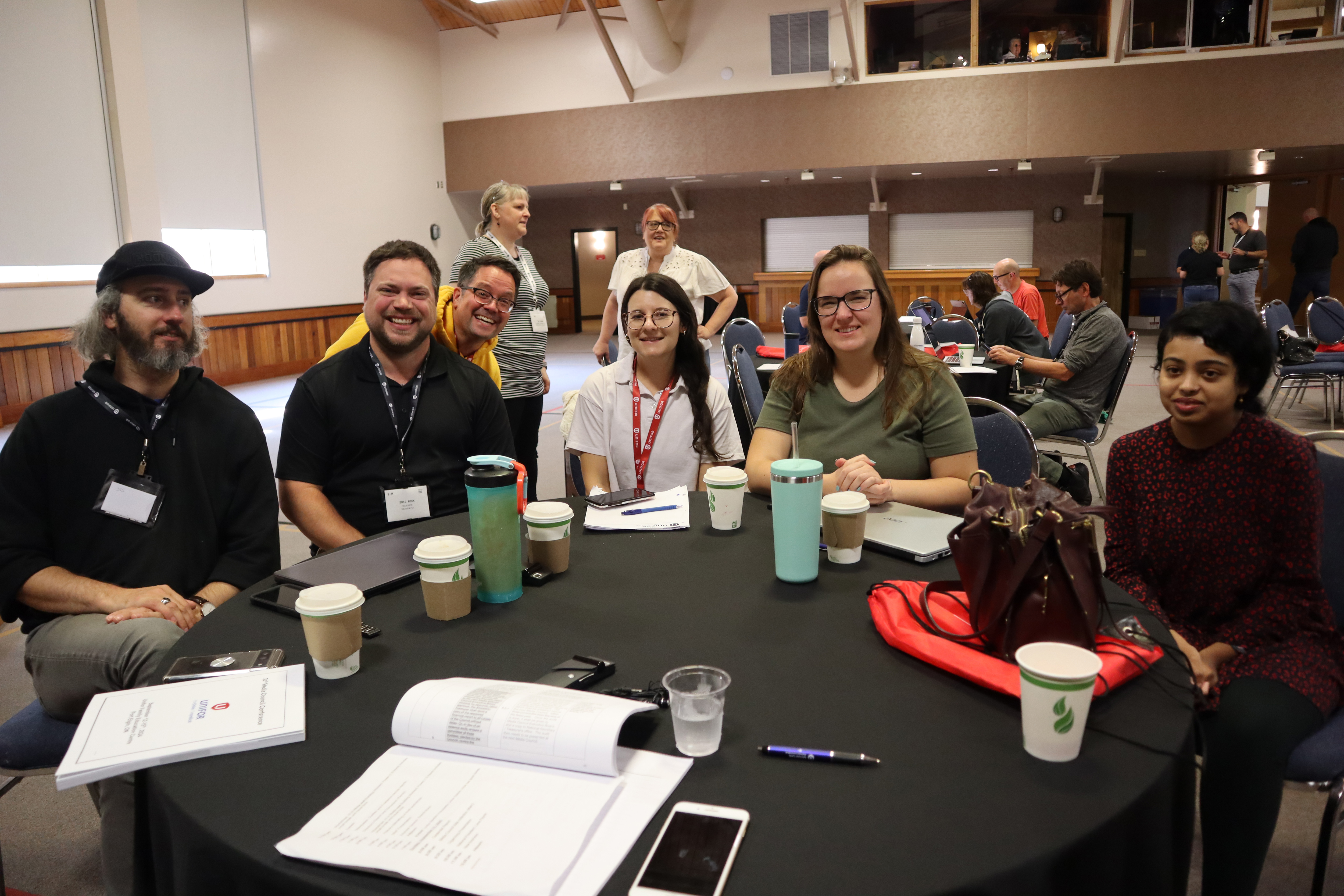 6 people sitting around a table