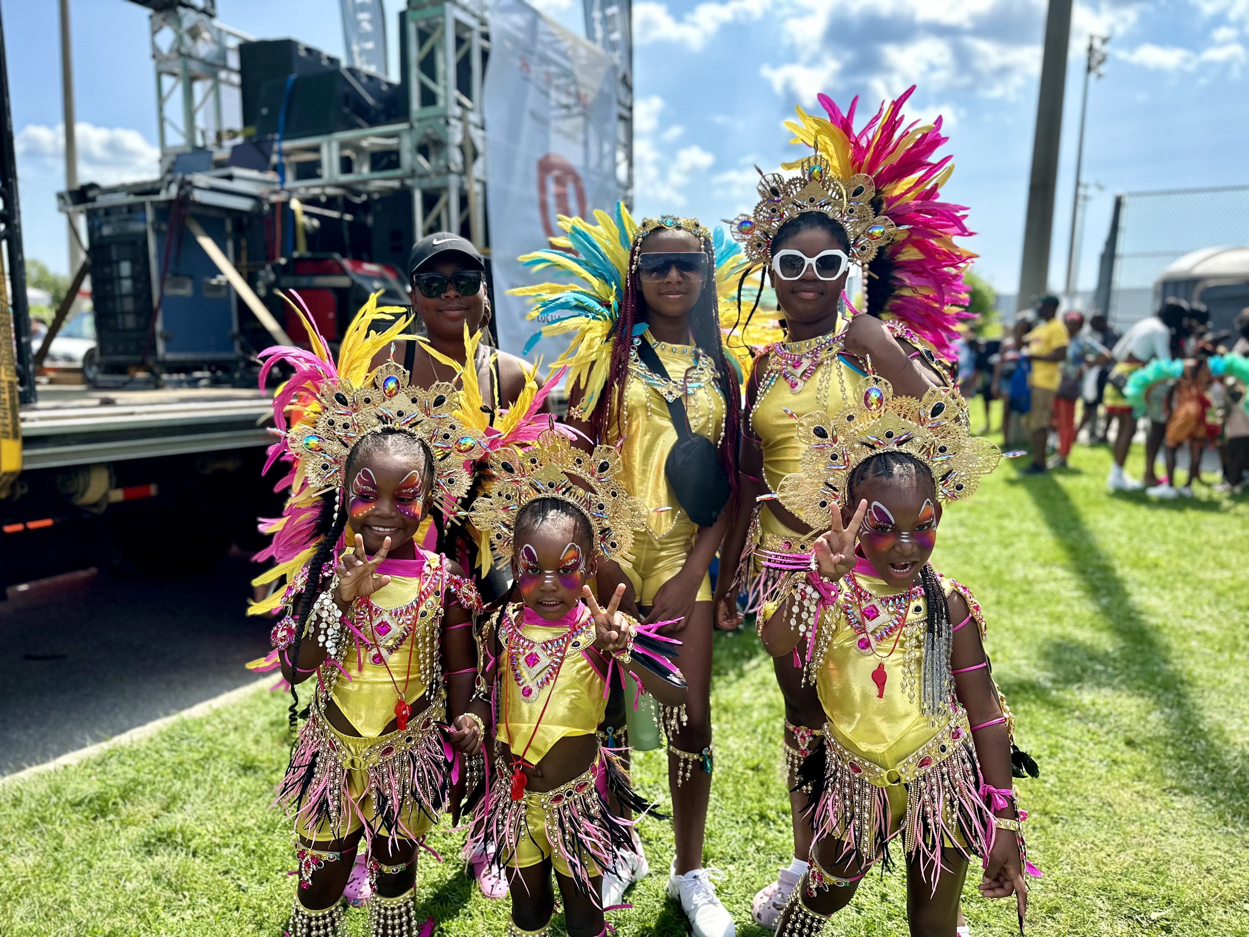 A family wearing yellow feathered costumes.