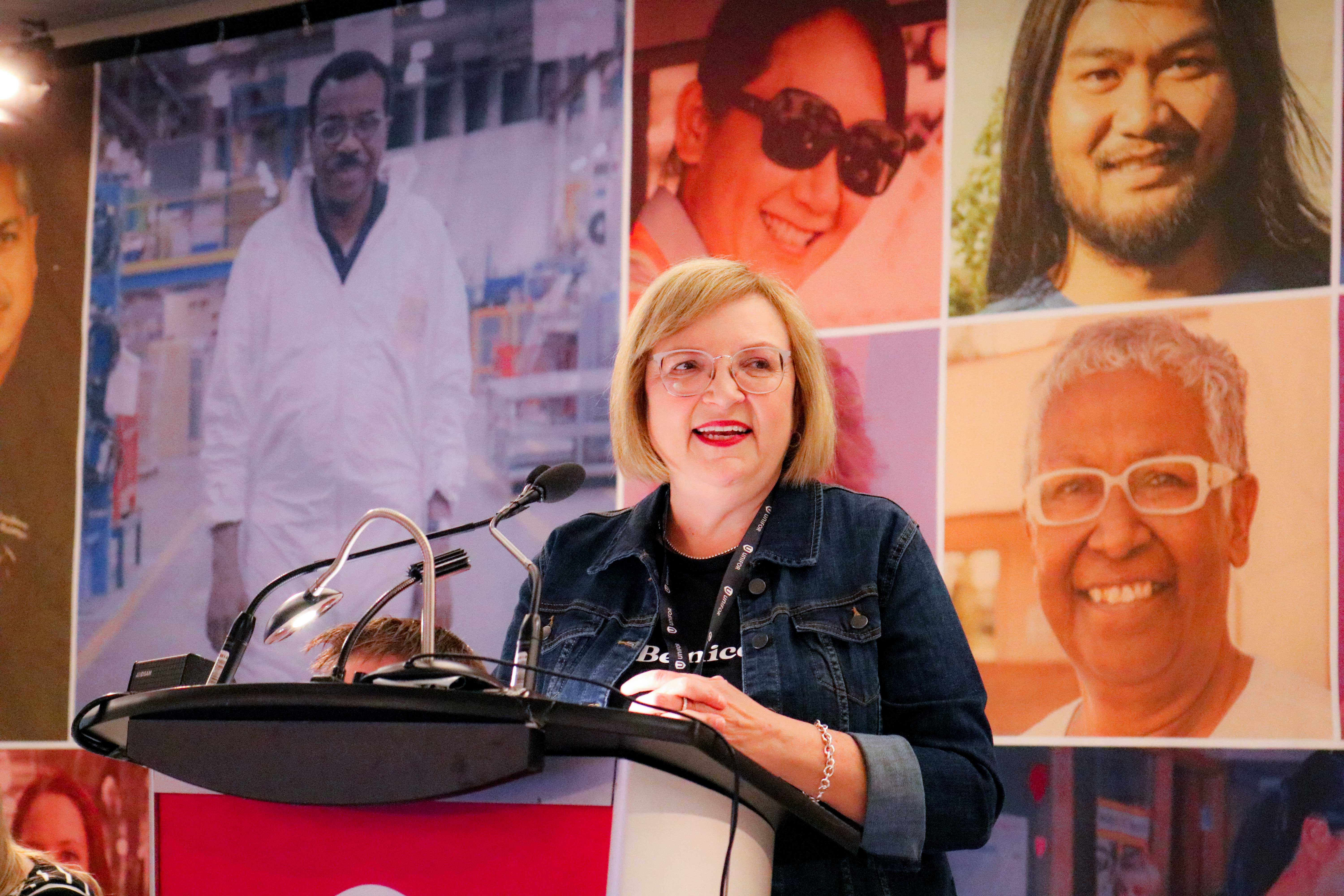 Lana Payne speaking at a podium