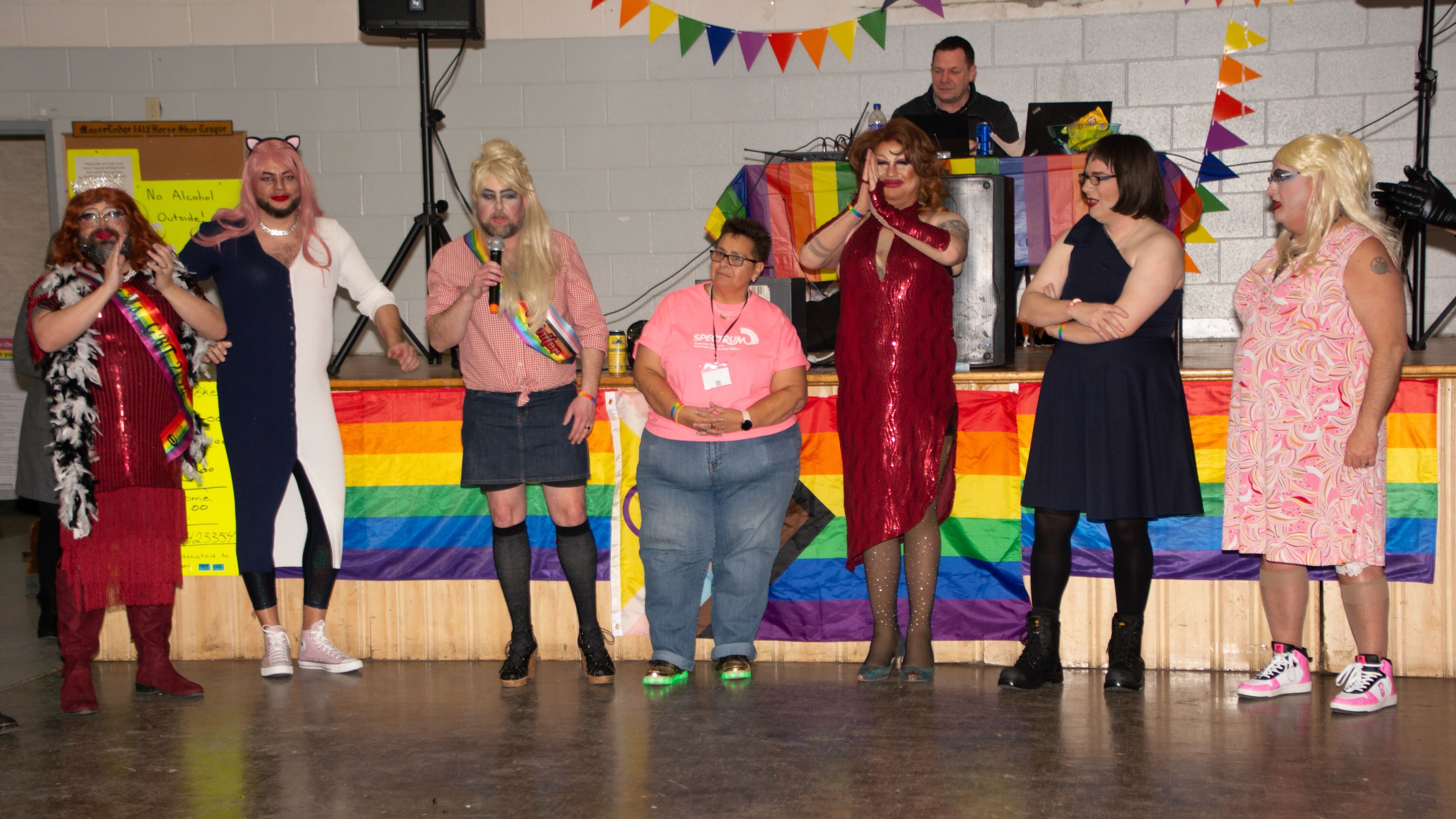 Seven drag queens performing 
