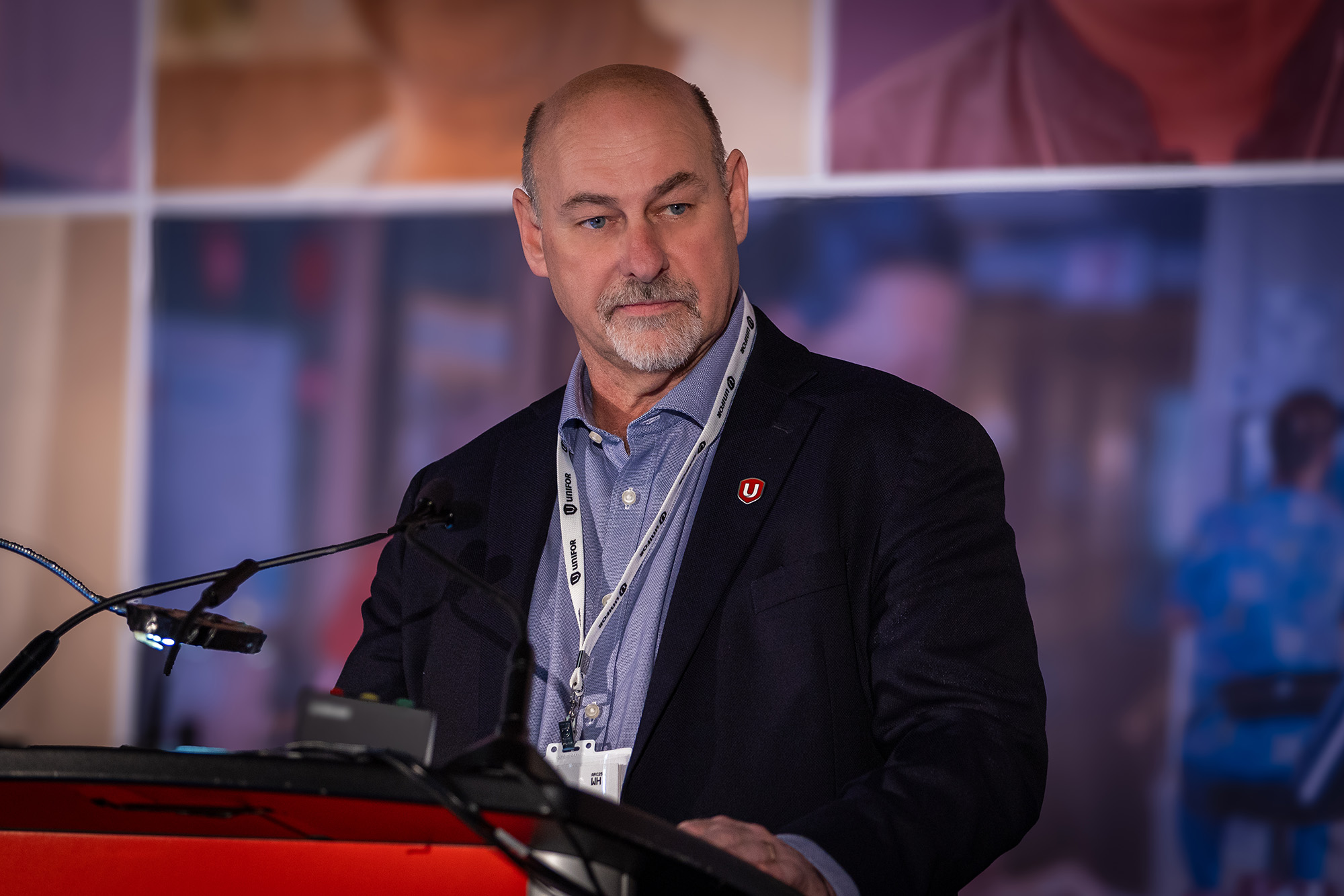 a man standing at a podium
