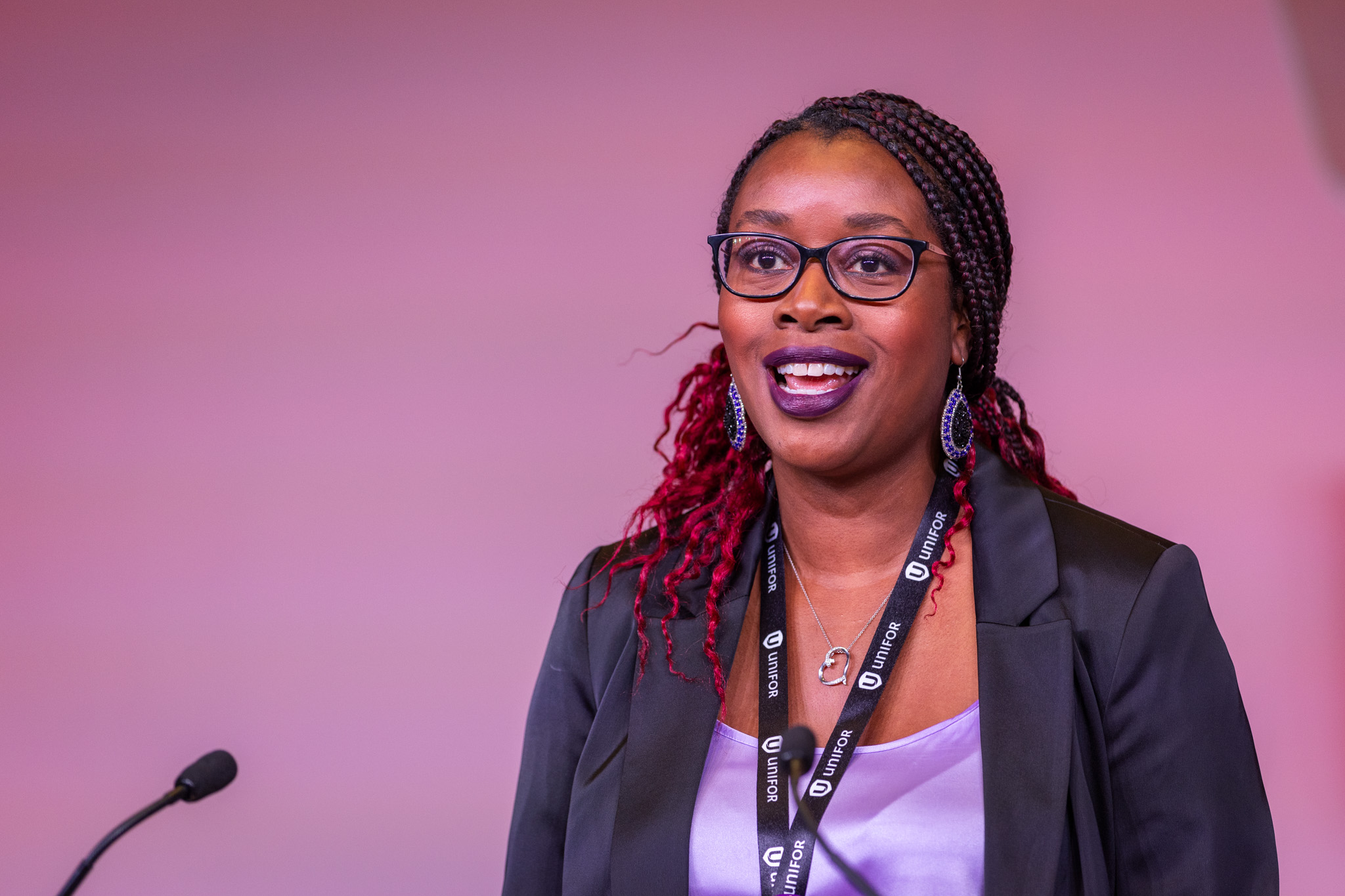 A women speaking at a mic