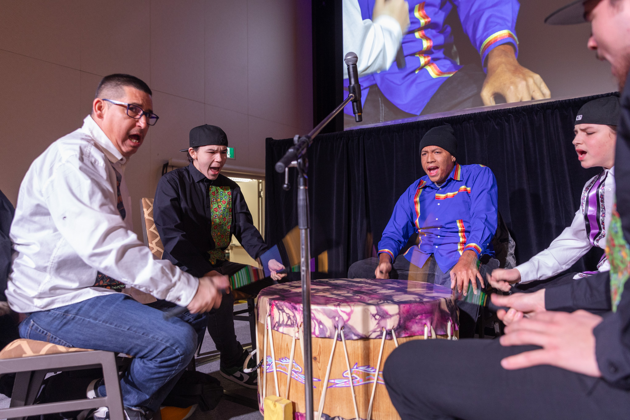 Four young men drumming