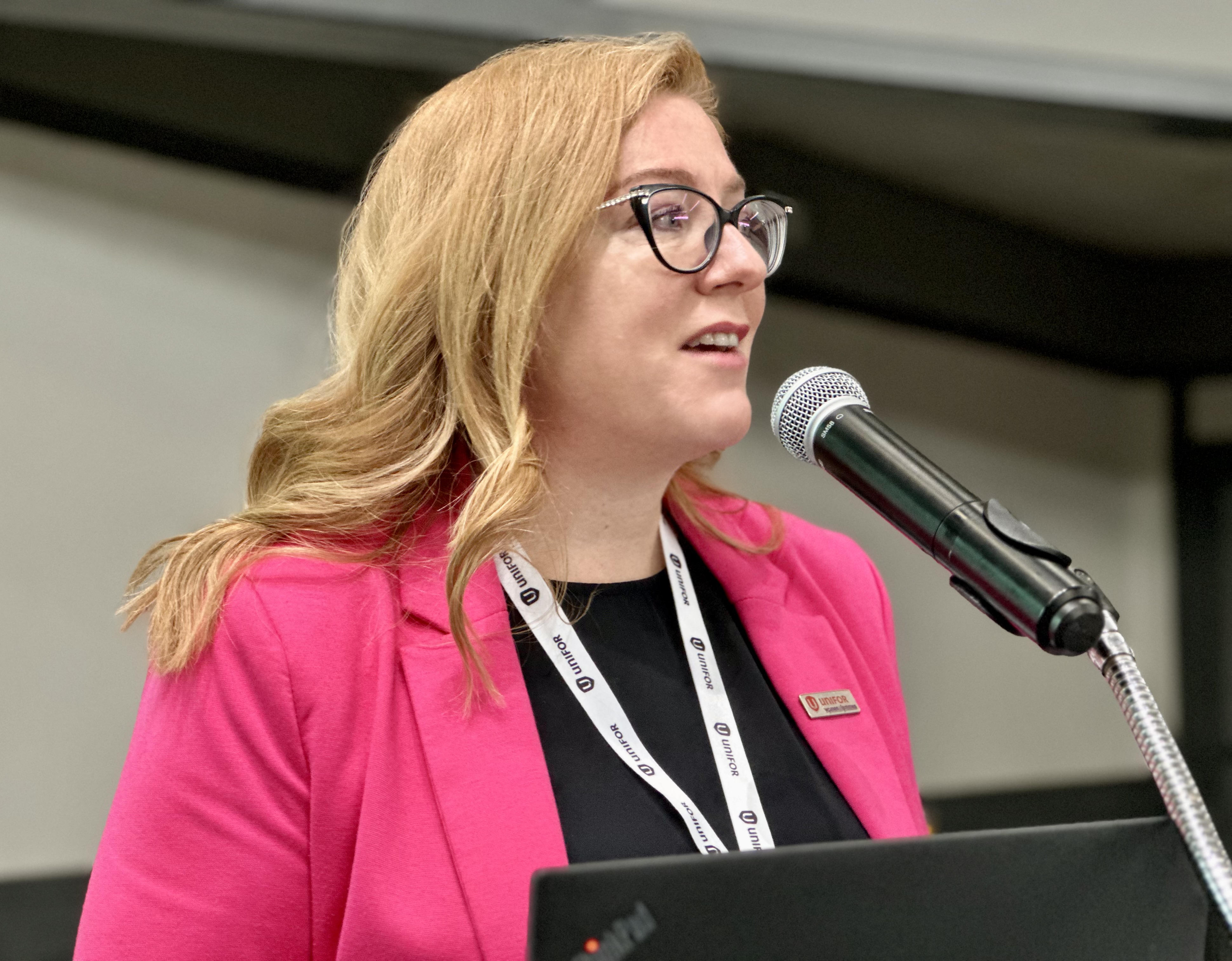 A woman speaking at a podium