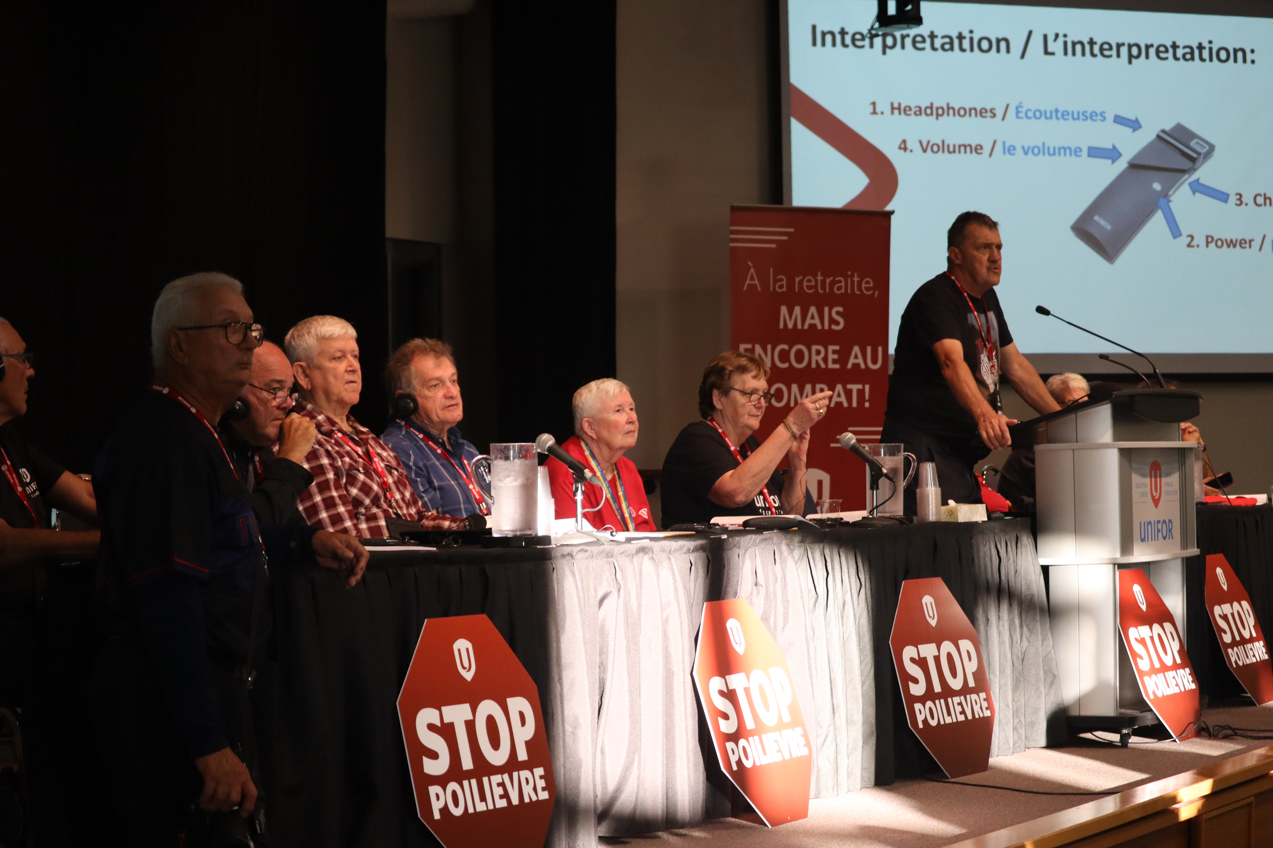 A man speaks at a podium