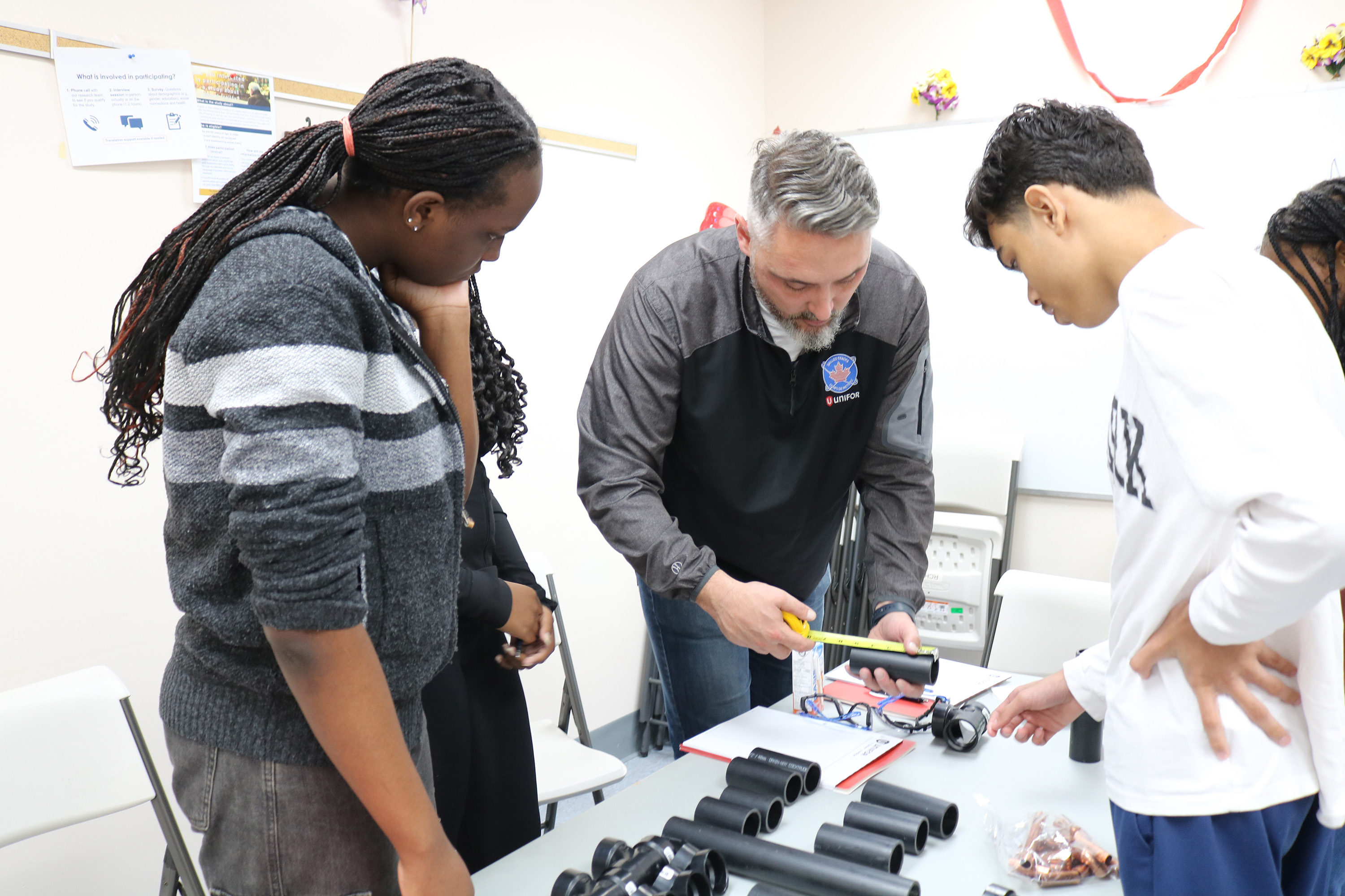 Paul teaching students on a hands on structure
