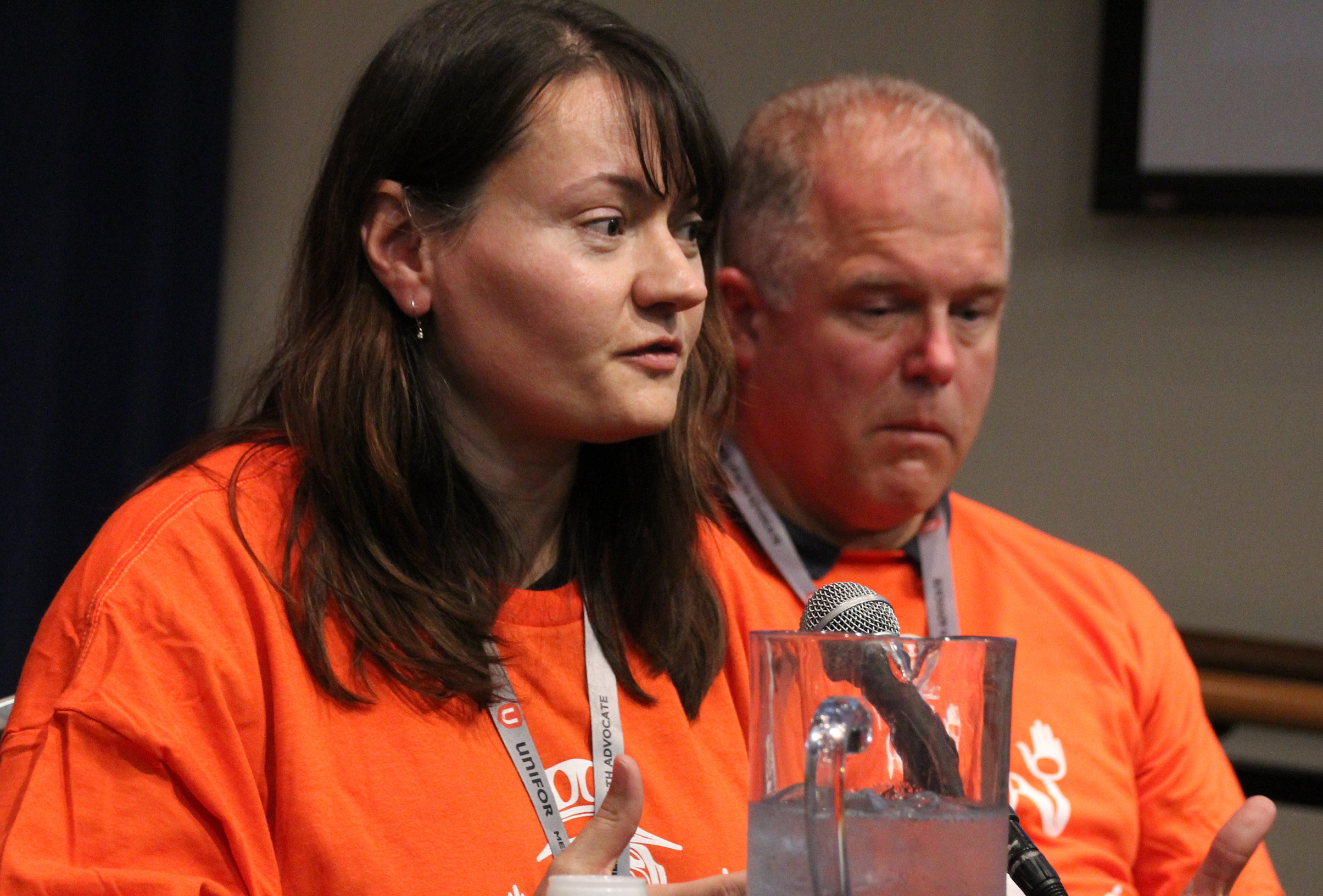 Sylvie Schmitt speaking at a microphone