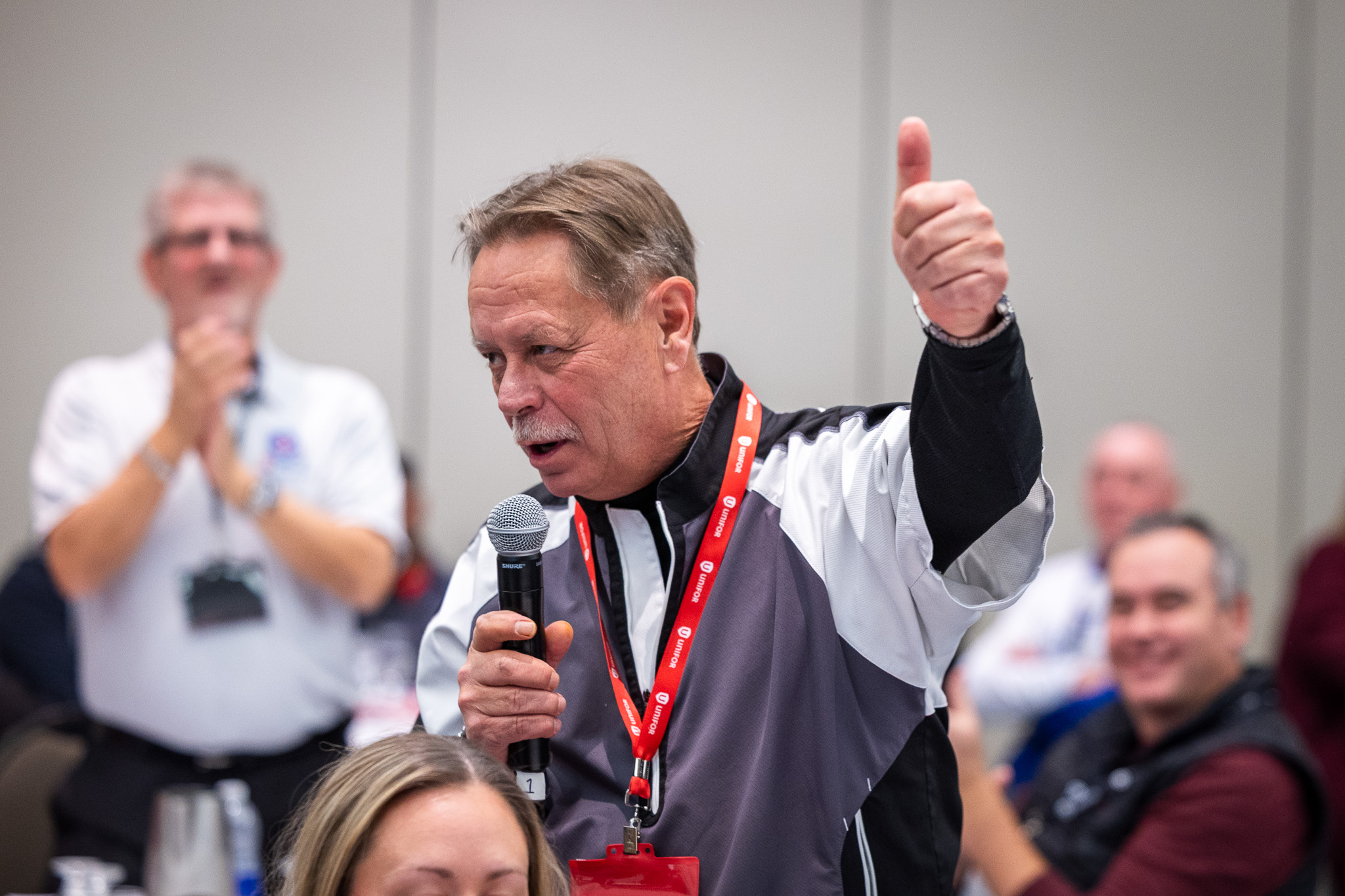 a man speaks into a mic