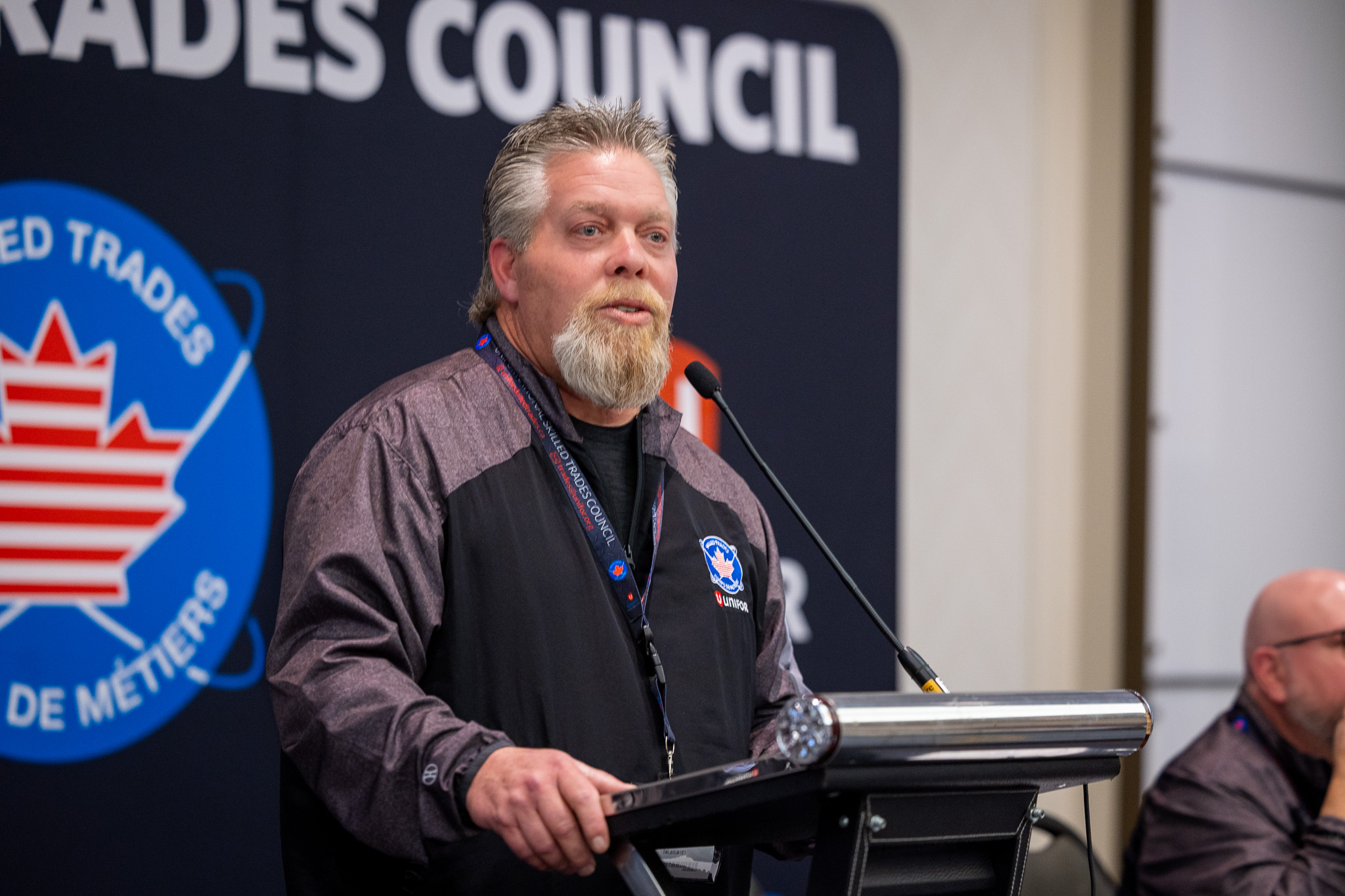 A man speaking at a podium