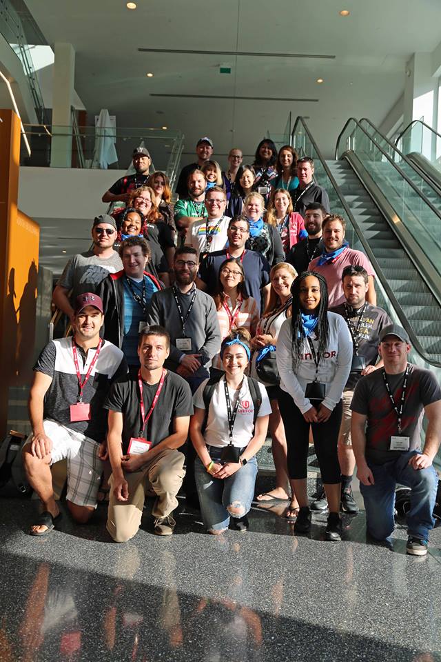 Young Workers grouped on a flight of stairs.