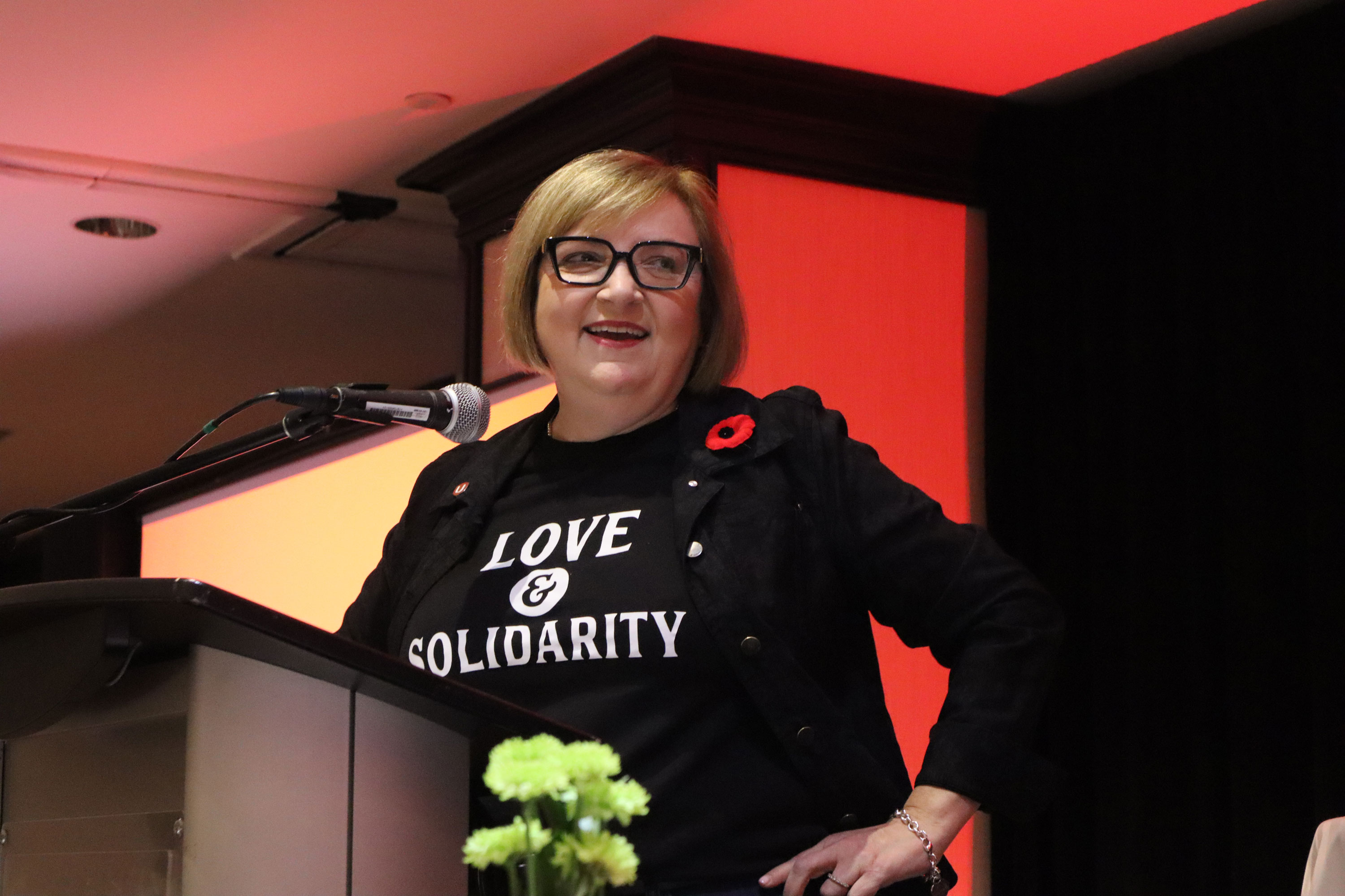 a women speaks at a podium