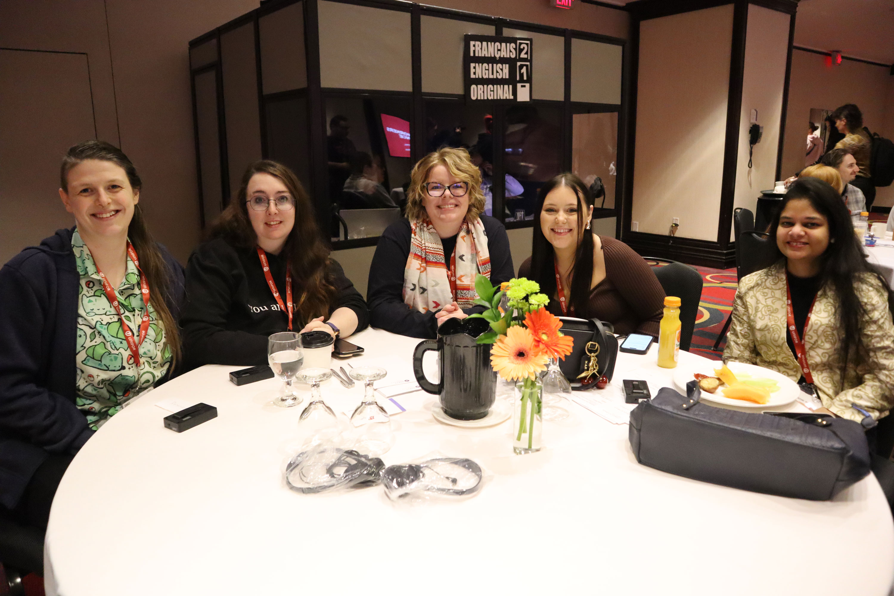 six people sitting at a table