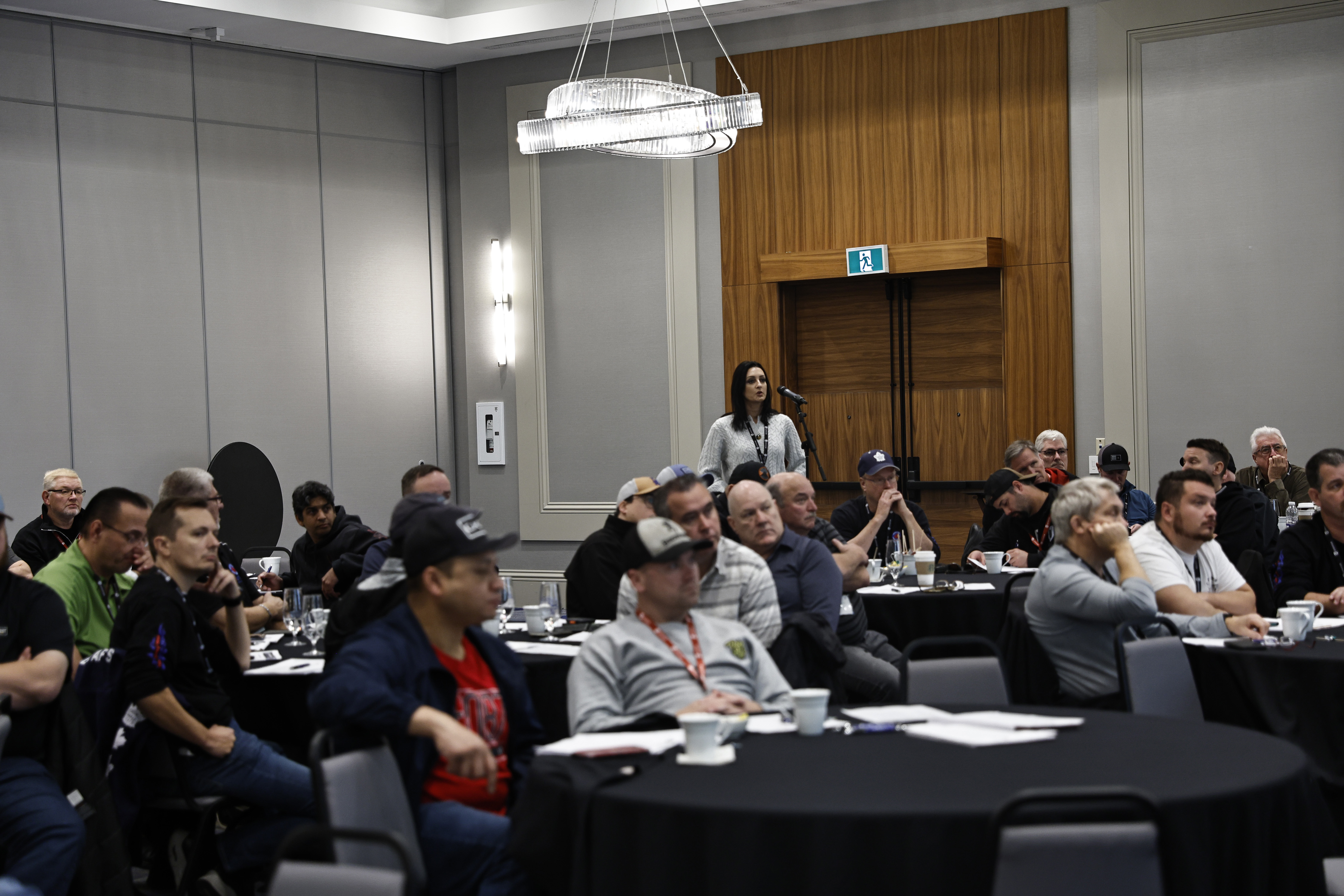 A women speaking into a mic