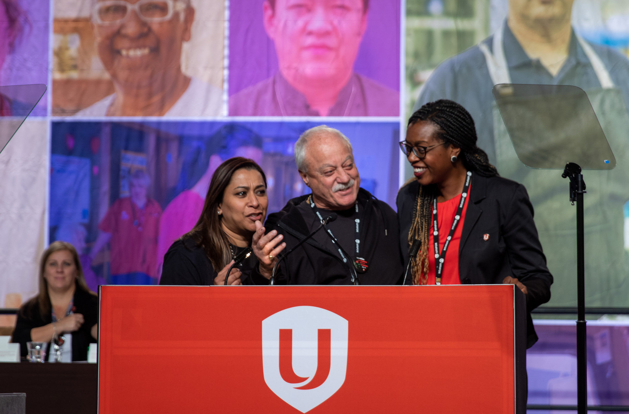 Naureen Rizvi, Tullio DiPonti and Shinade Allder at the podium addressing council.