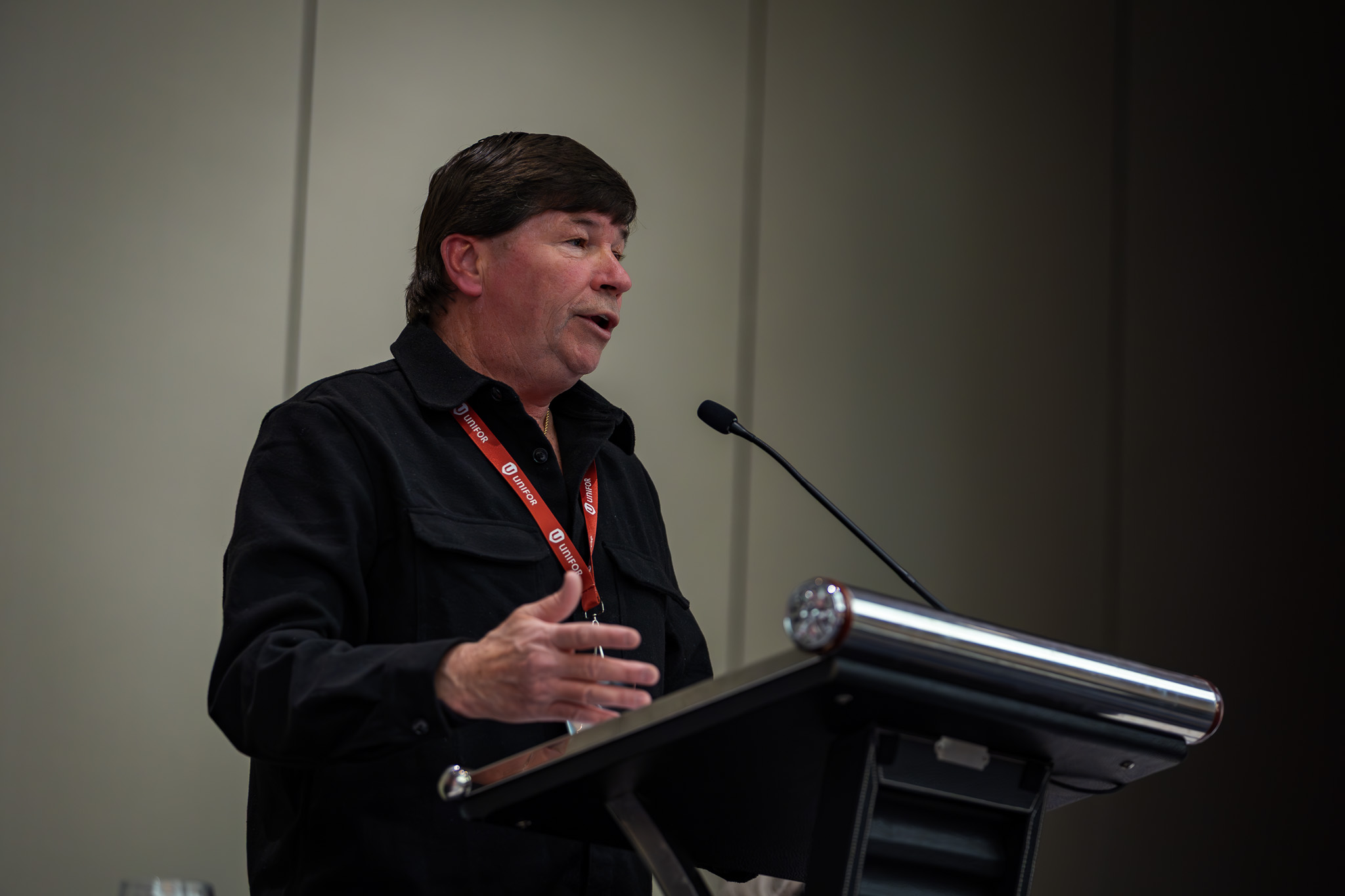 A man speaking at a podium