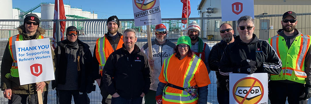 Gaving McGarrigle stands with warmly dressed Unifor members on a picket line at Co-Op Refinery.