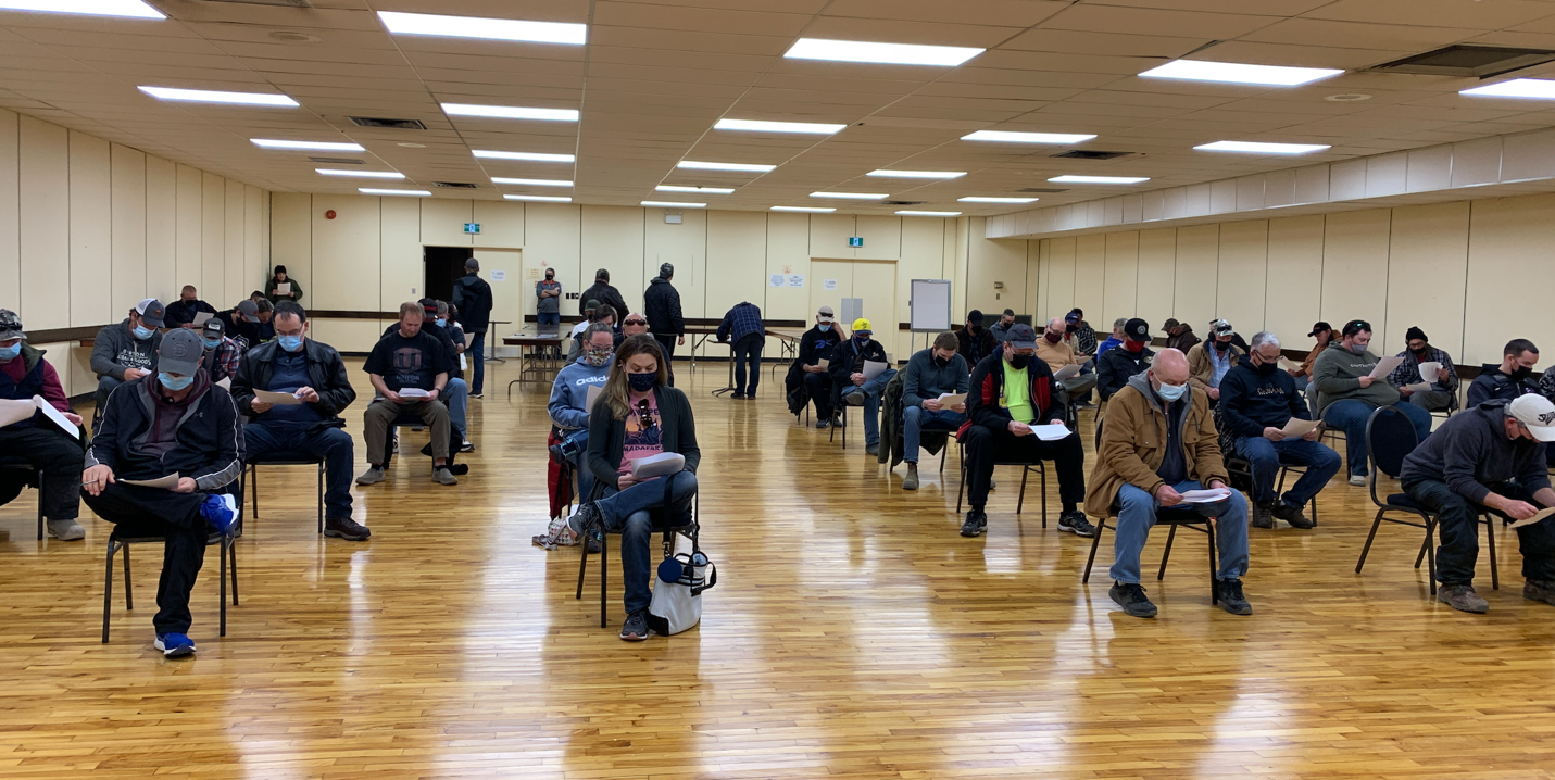70 Unifor Local 914 members sit six feet apart in gymnasium at ratification meeting
