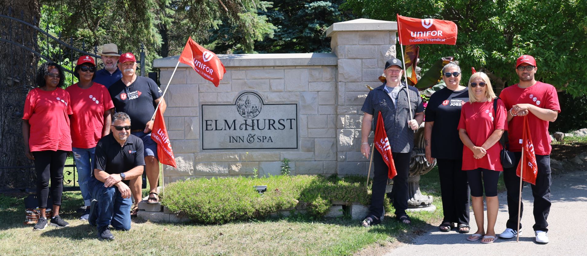 group of people in front of Elm Hurst Inn sigh 