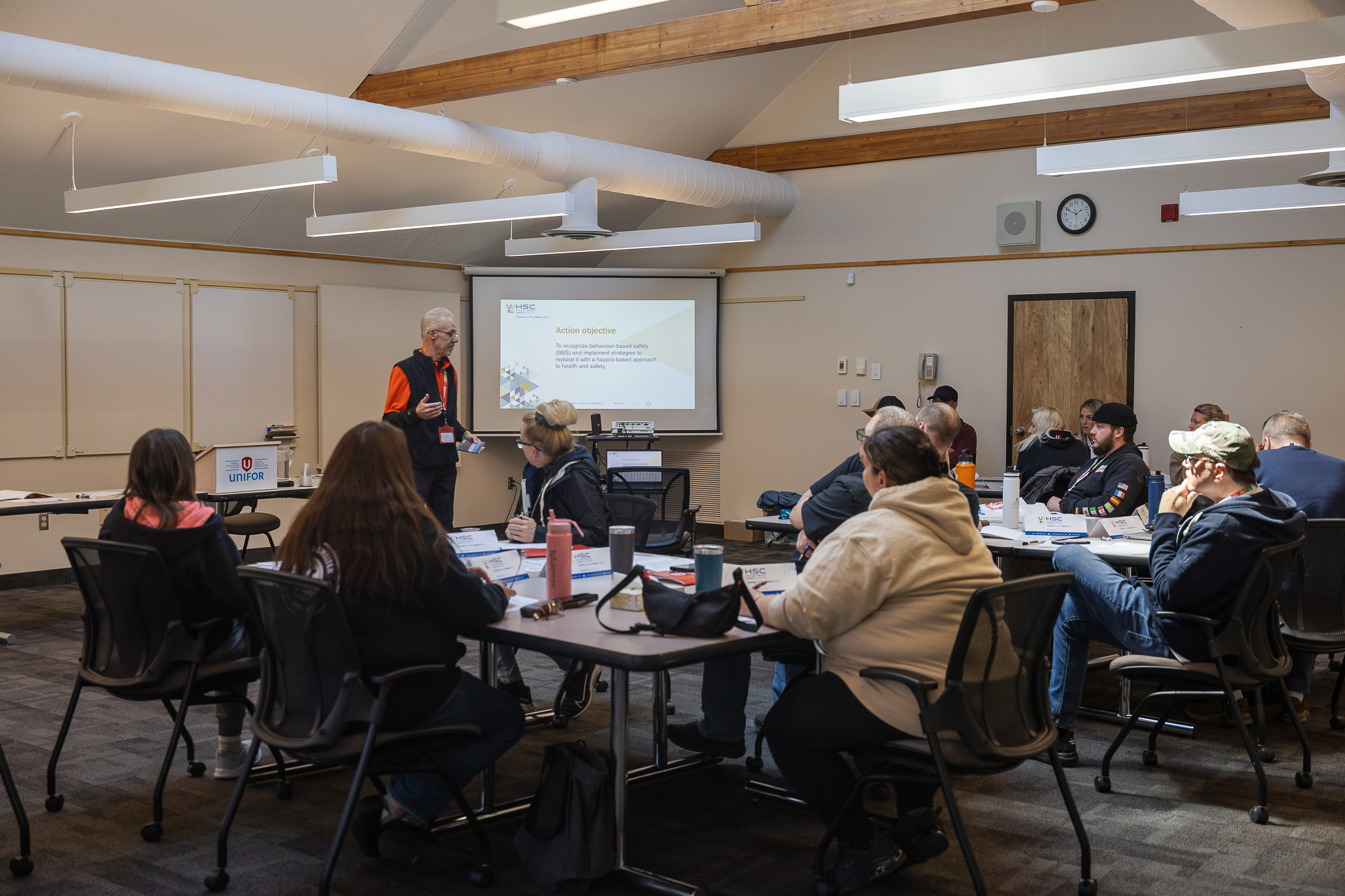 People sitting in breakout groups in talks