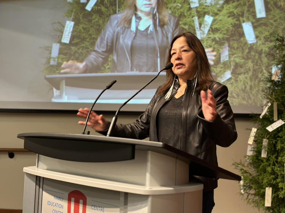 a women speaking at a podium