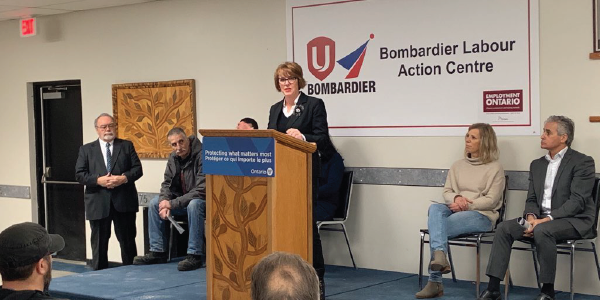 Bombardier Action Centre coordinators, government officials and Unifor Local 1075 President Dominic Pasqualino speaking at a news conference.