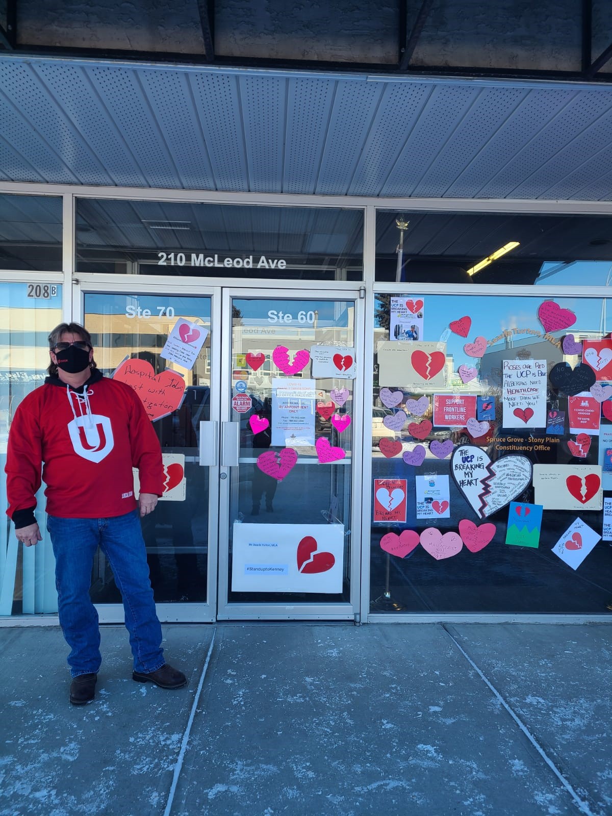 Unifor members take broken heart valentine messages to Alberta MLAs offices.