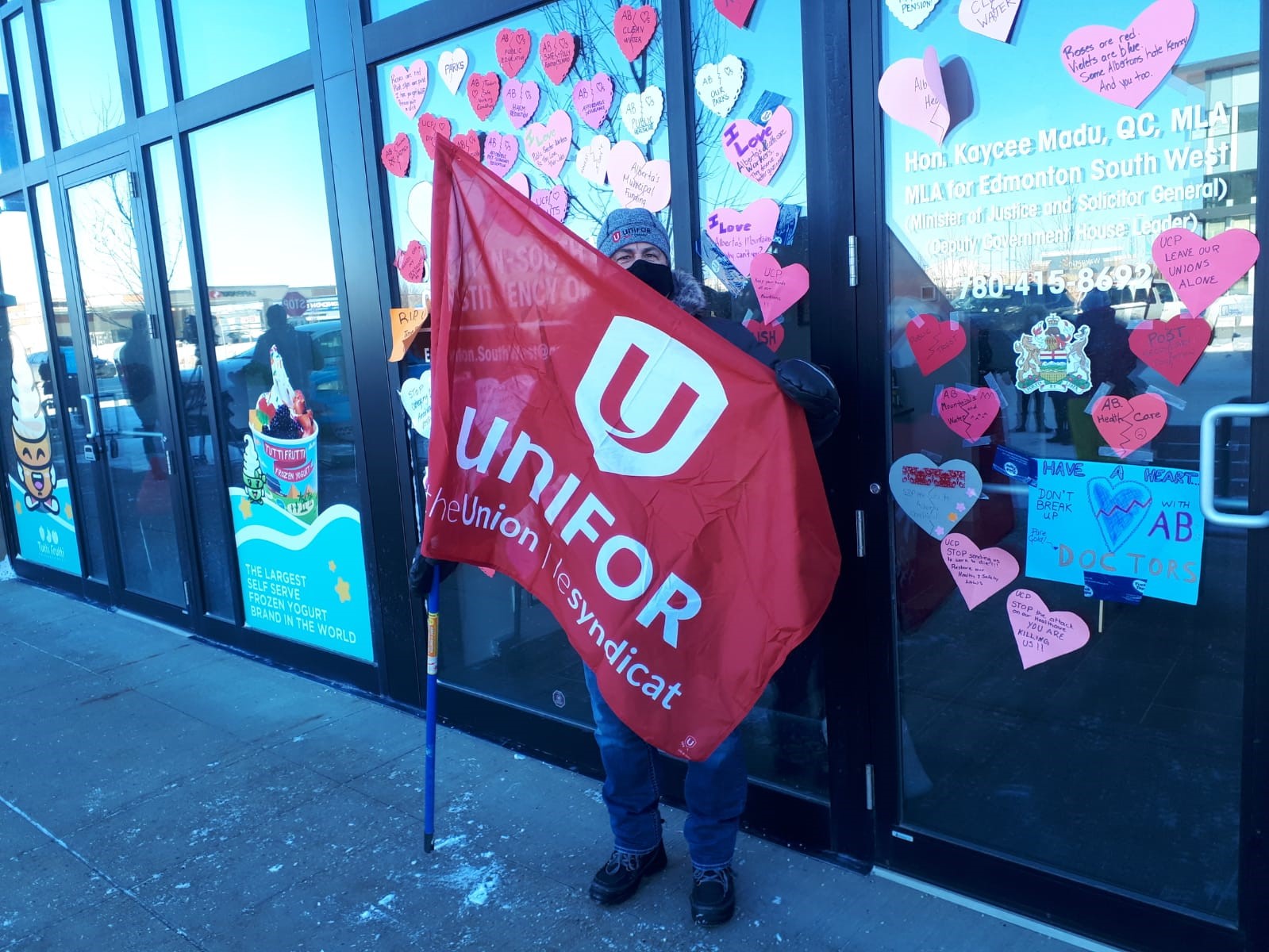 Unifor members take broken heart valentine messages to Alberta MLAs offices.