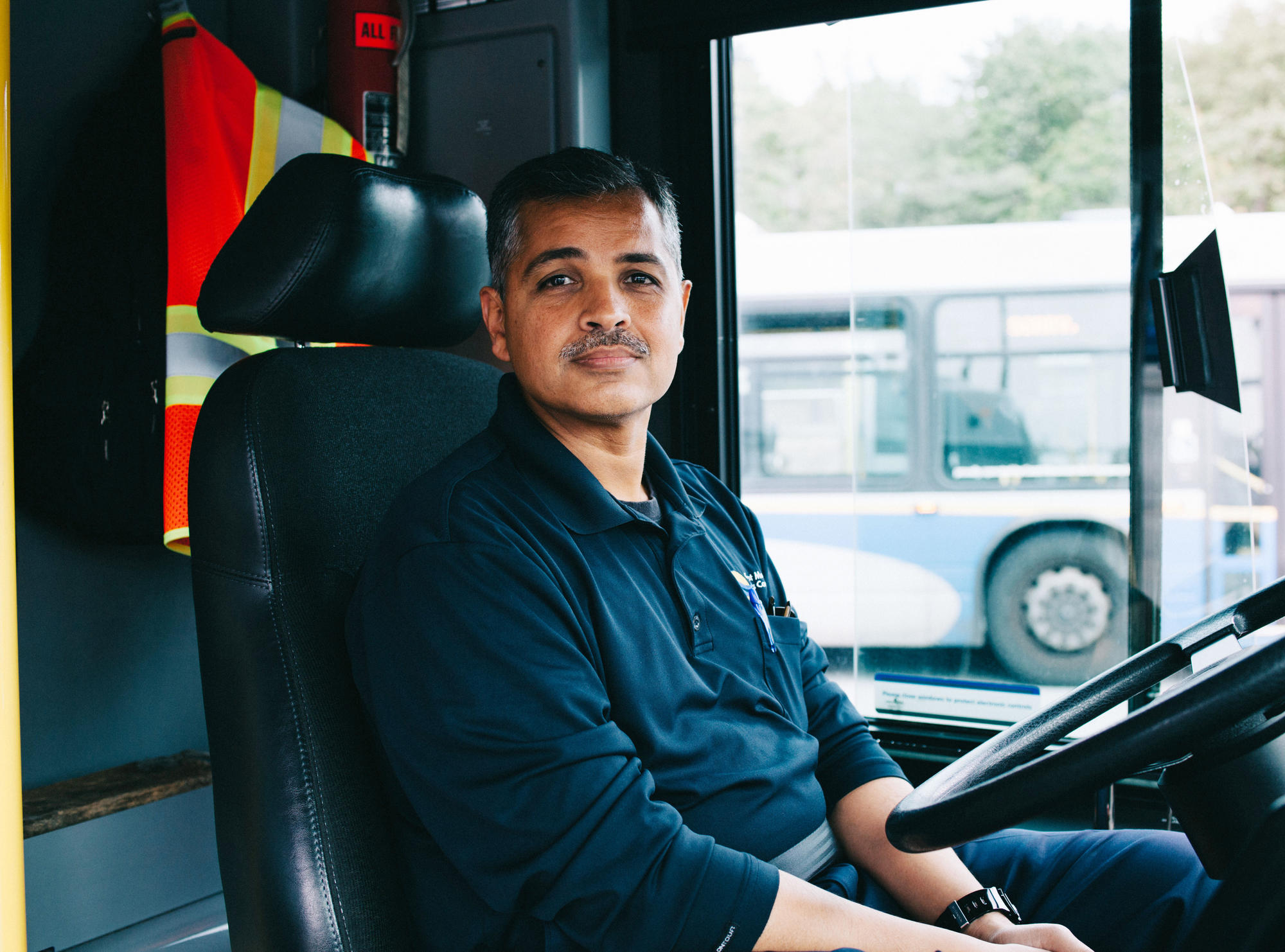 A Unifor member working as a bus driver.