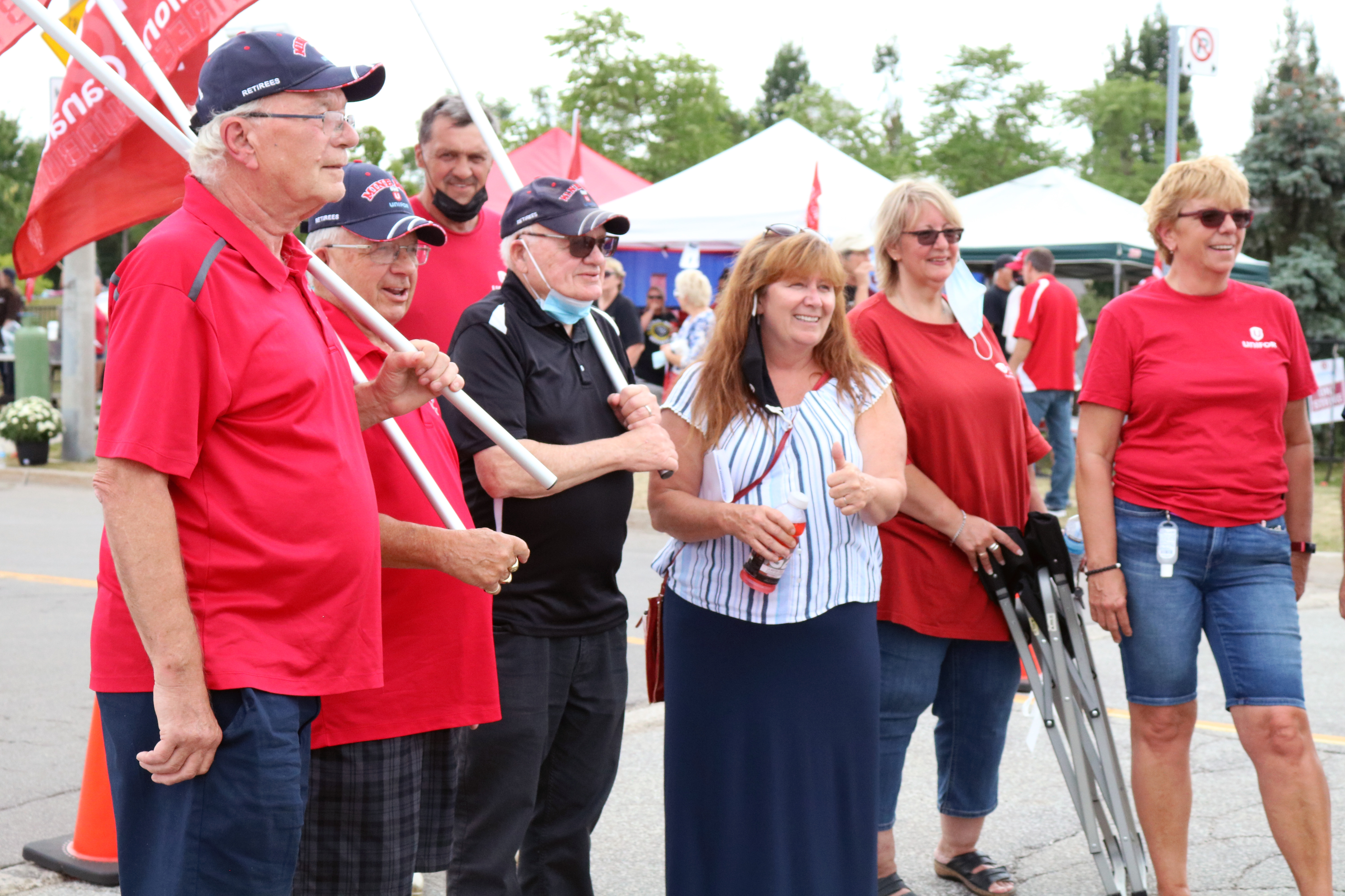 Local 673 President Maryellen McIlmoyle meets with retirees during a rally at the De Havilland plant