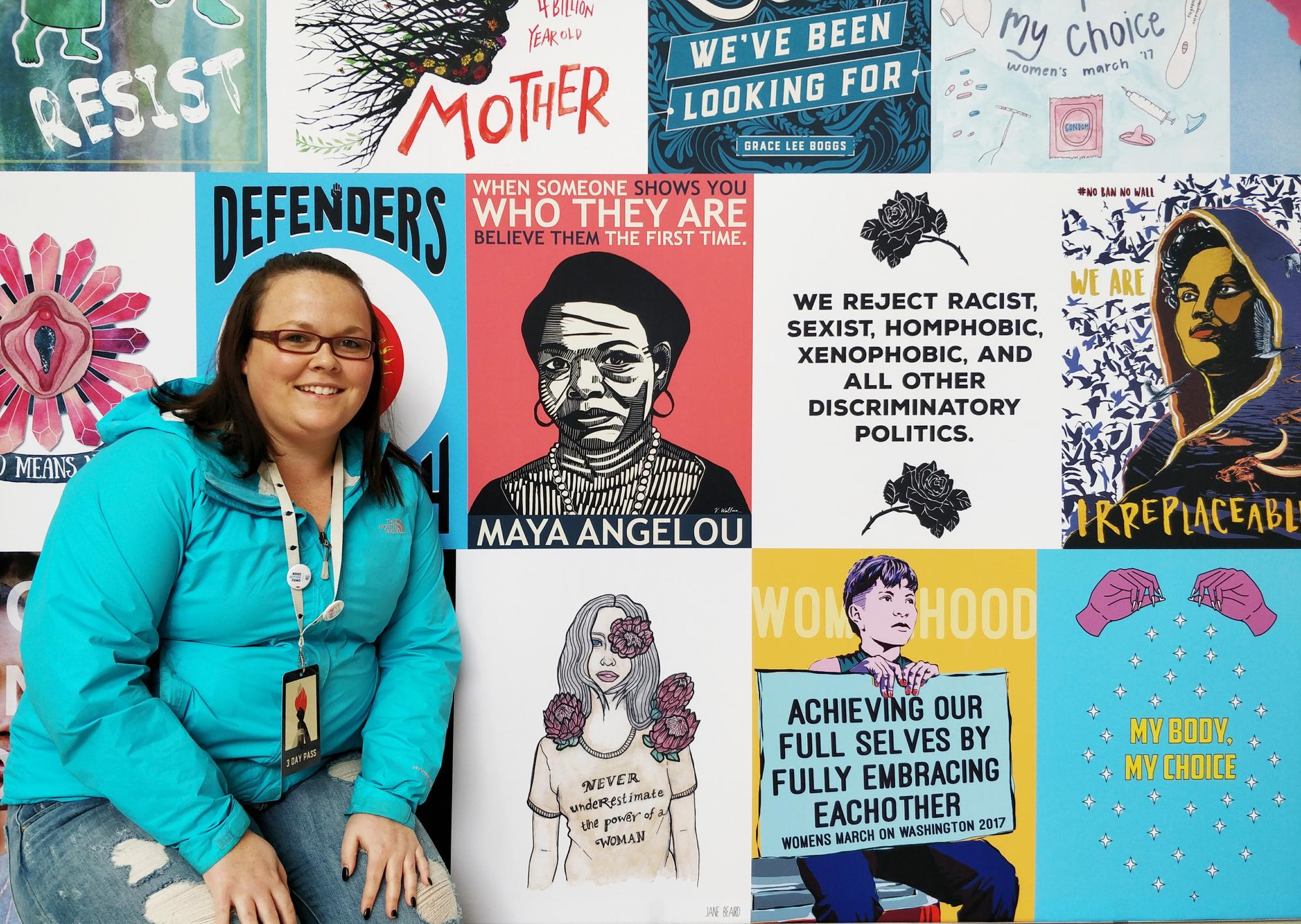 Jennifer Werrett of Unifor Local 649 poses in front of a large mural.