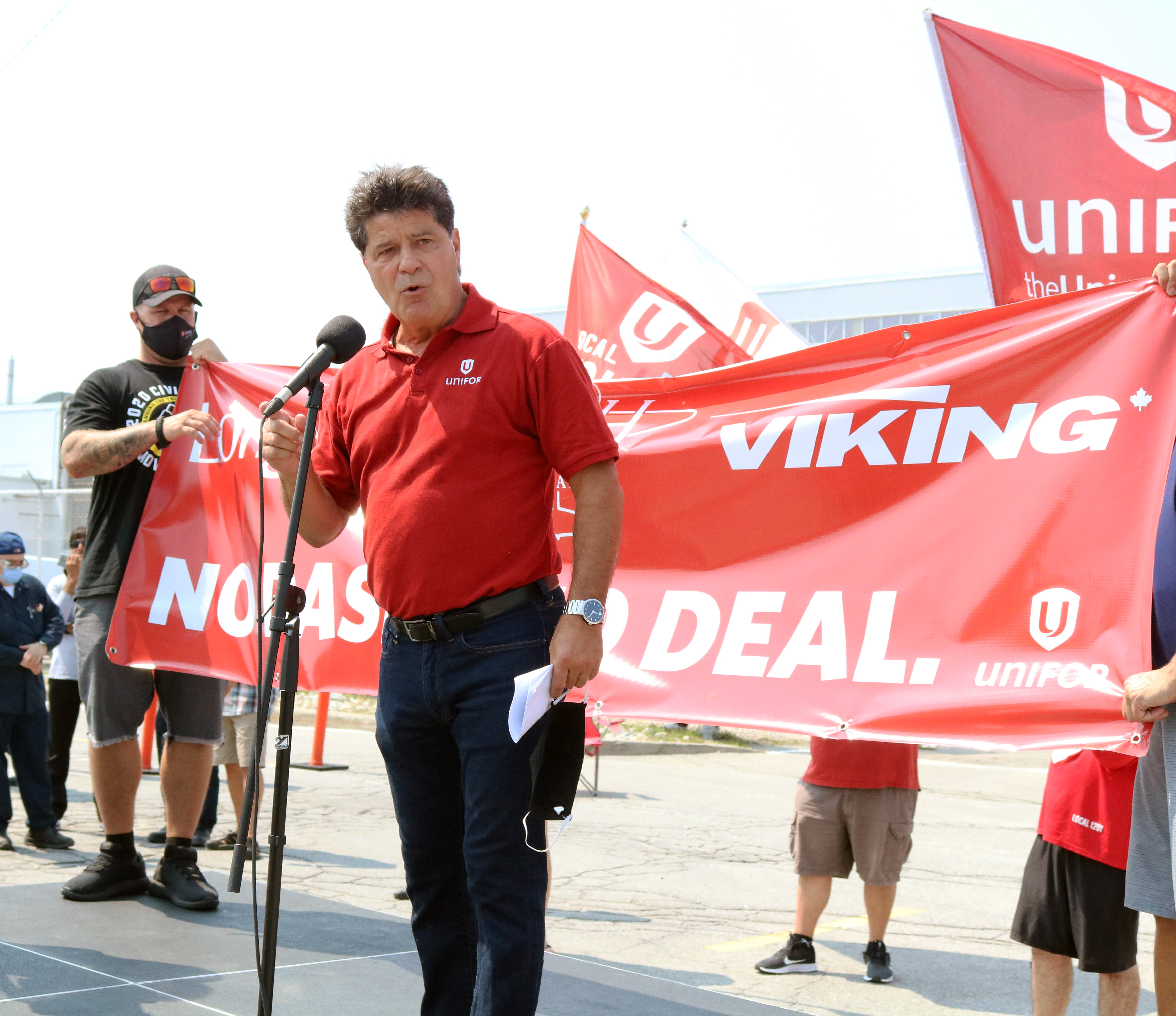 Unifor National President Jerry Dias speaks at a rally for striking De Havilland workers.