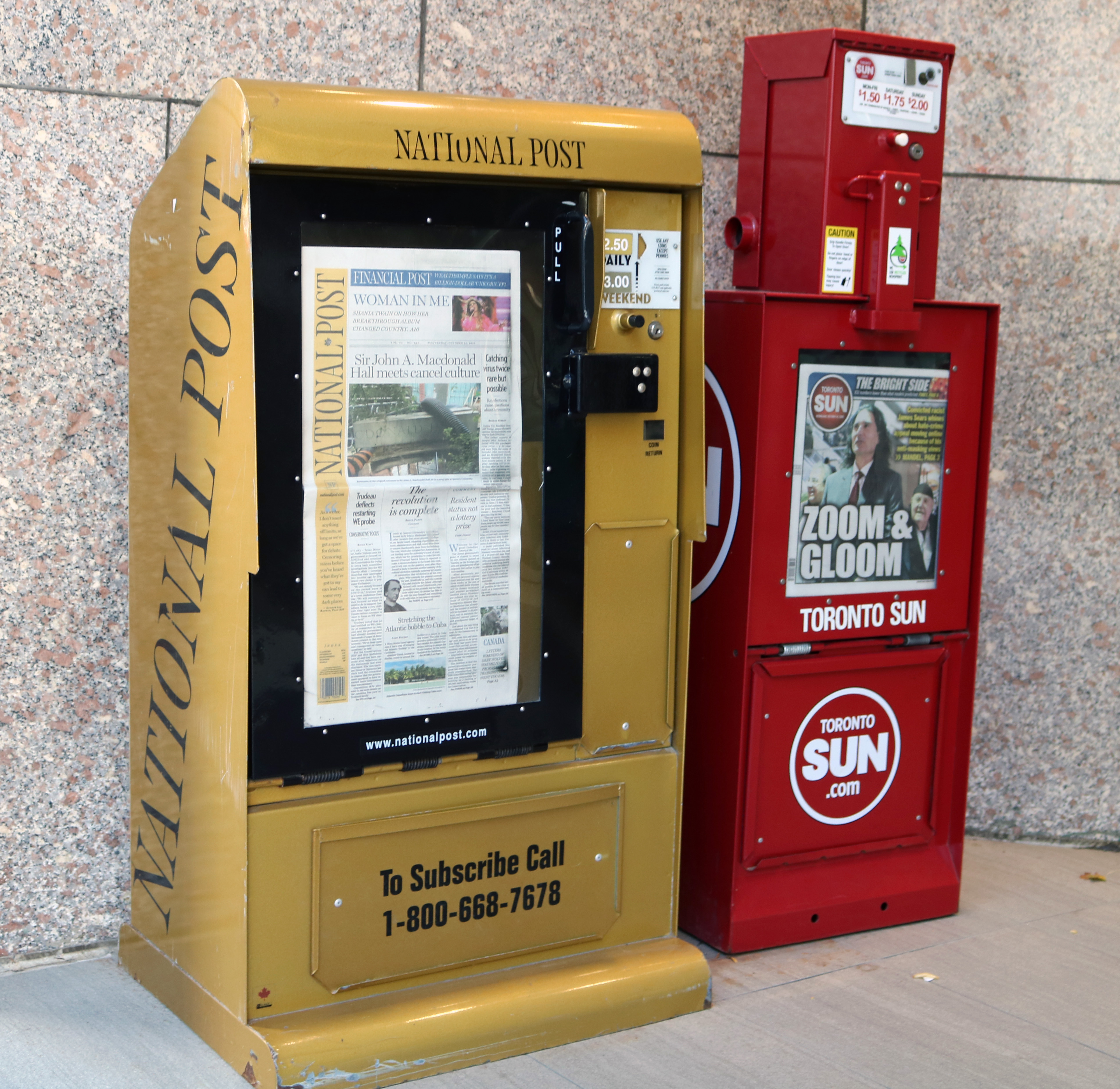 National Post and Toronto Sun newspaper boxes.