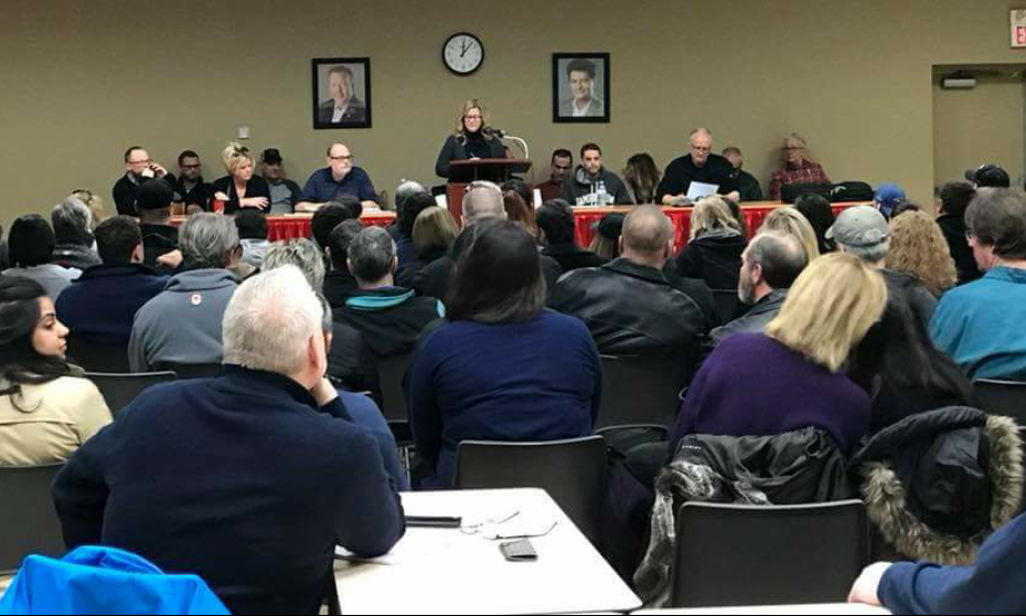Members of Unifor locals 240 and 517-G fill a meeting hall as they listen to remarks from Julie Kotsis.