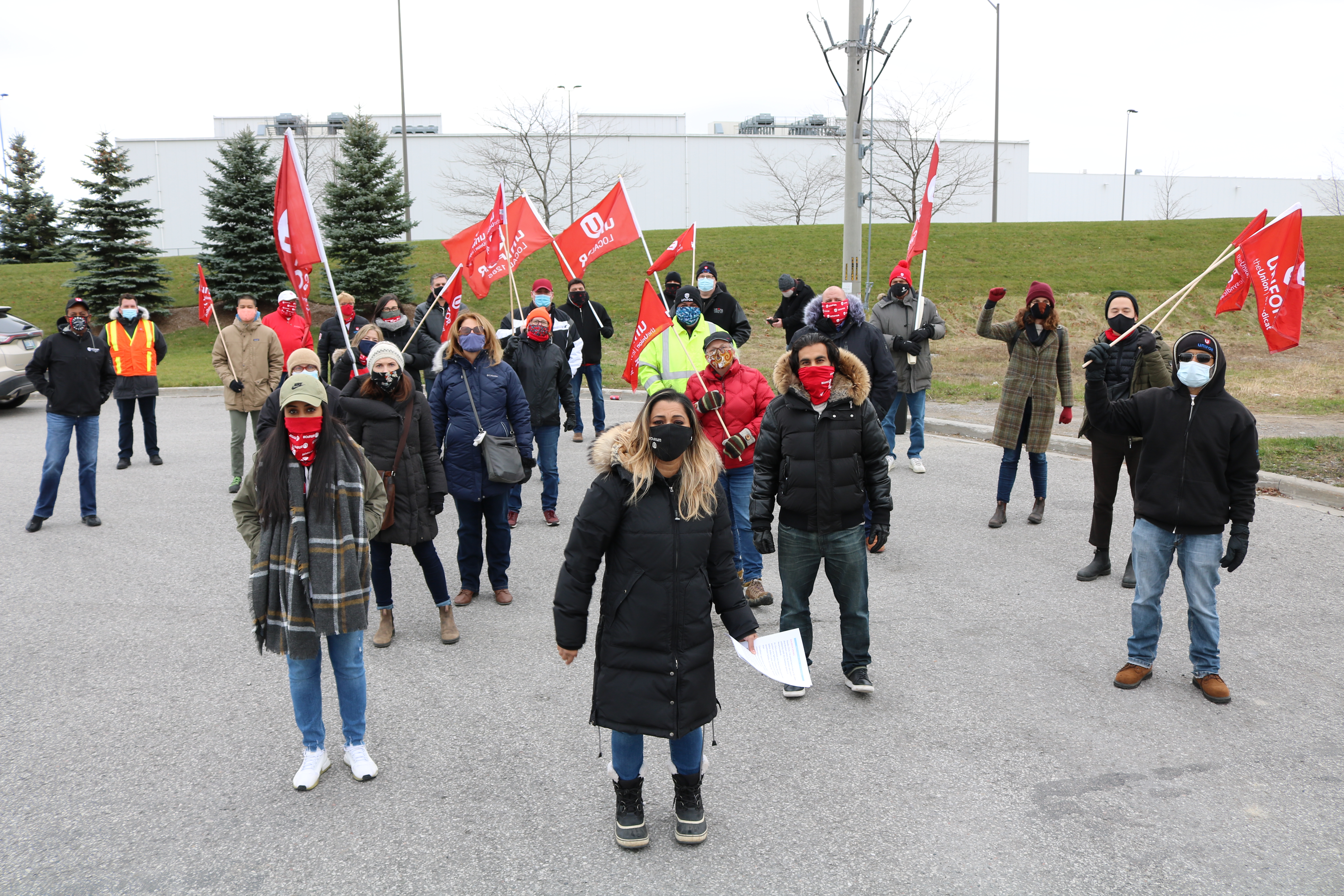 Naureen Rizvi with Unifor members in Ajax, Ontario.