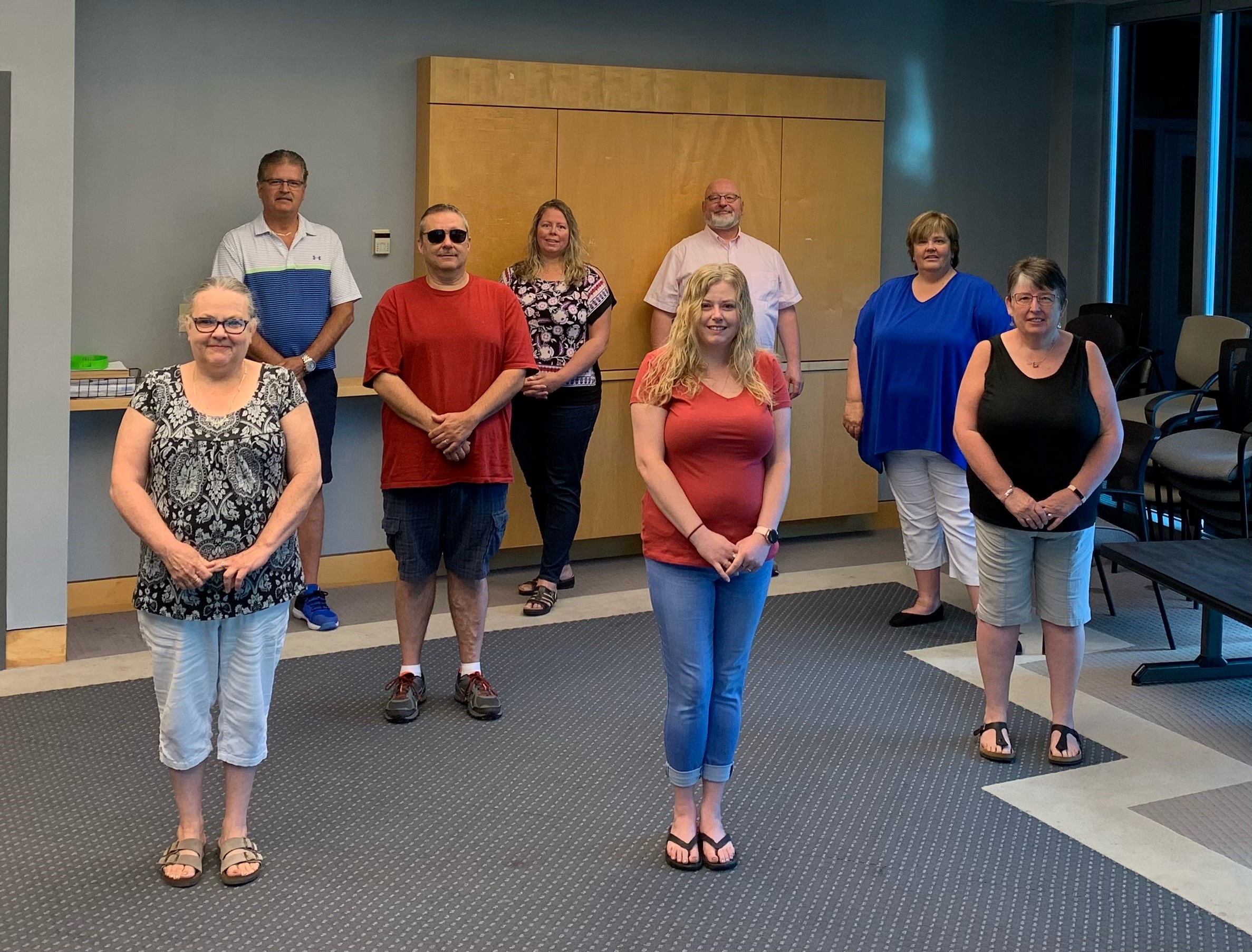 Northwood bargaining committee member's standing socially distant.